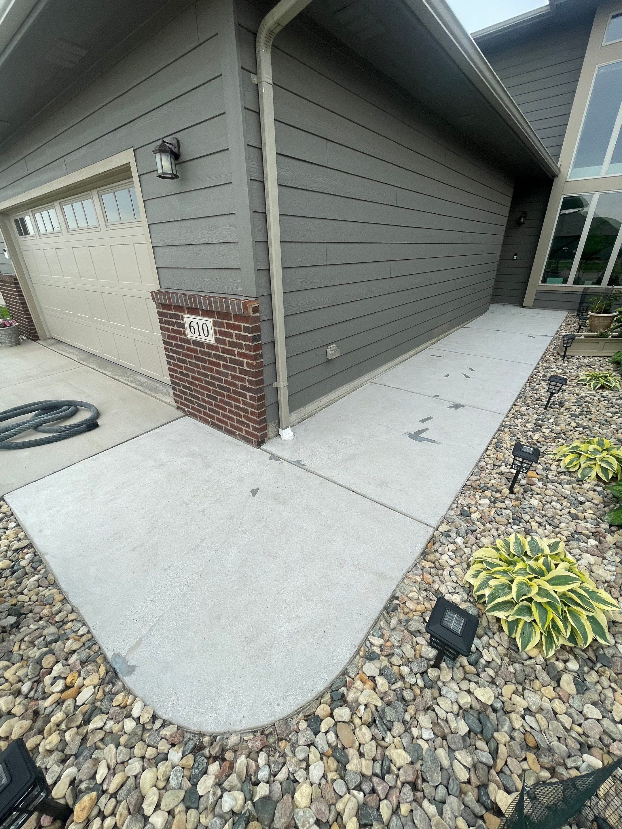 Custom Concrete Coating for Sioux Falls Patio and Front Walkway by Select Painting, Coatings & Garage Cabinets