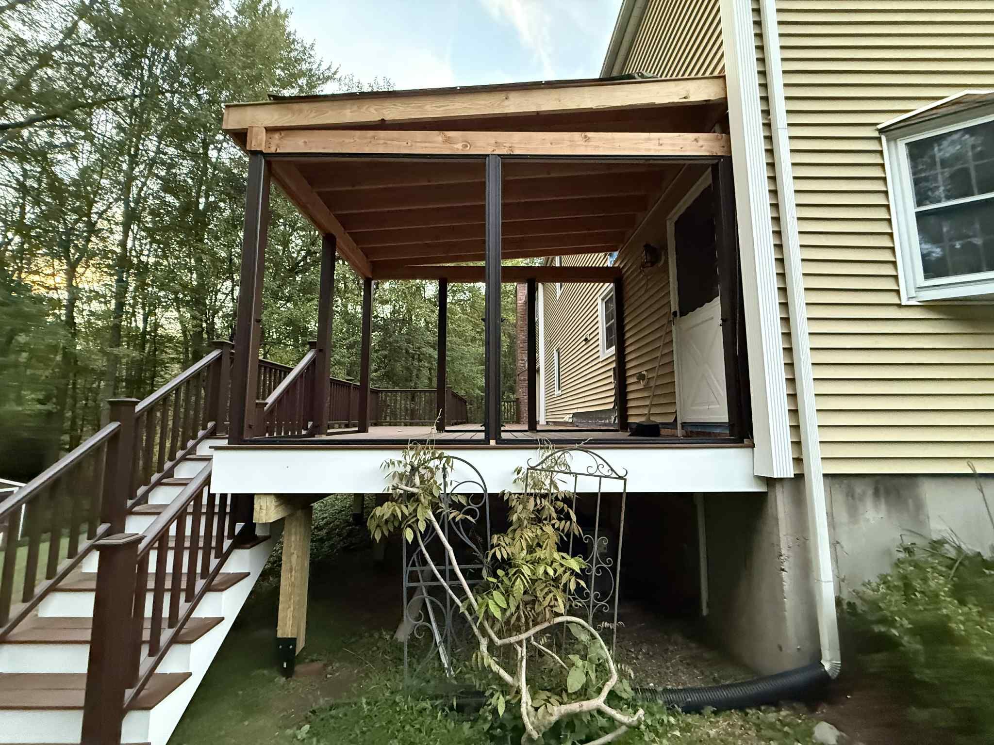 Deck and Screened in room replacement with Trex Saddle and vintage lantern railings by DiGiorgi Roofing and Siding Inc