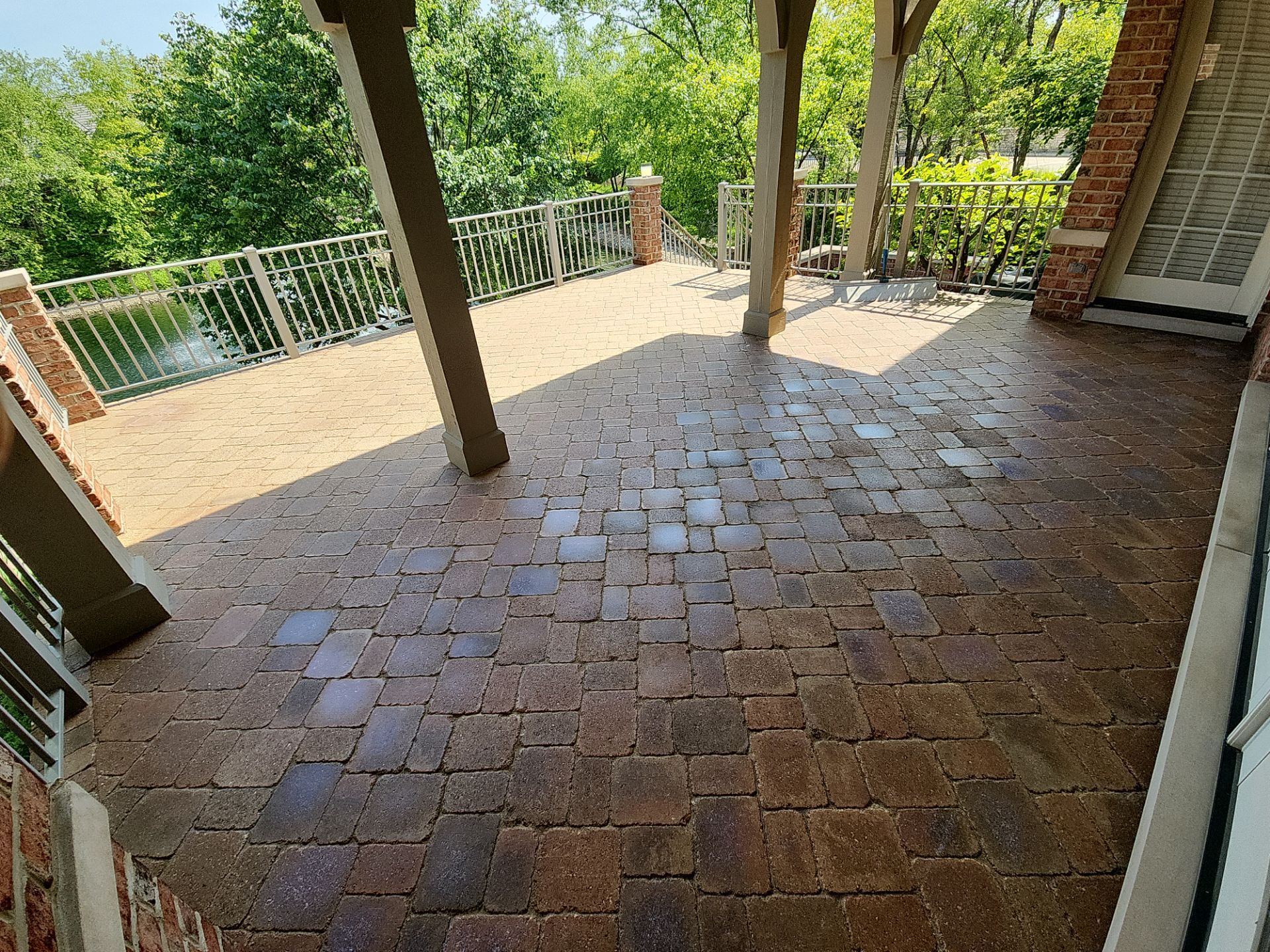 Brick paver cleaning sanding and sealing by Northern Power Washing LLC.