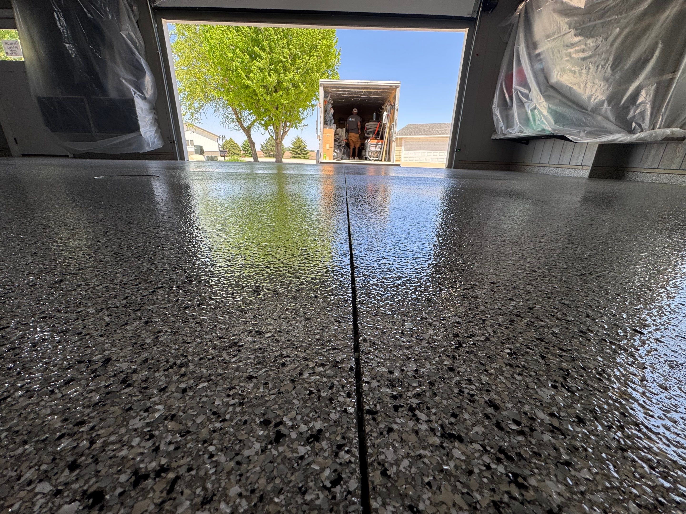 High-Gloss Grey Epoxy Floor Coating for Inwood Garage by Select Painting, Coatings & Garage Cabinets