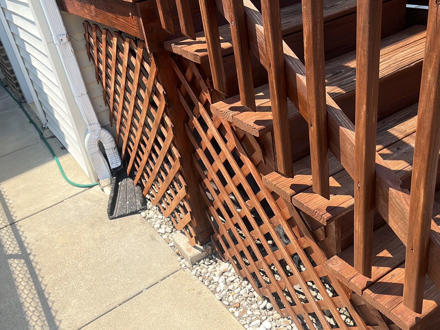 Wood cleaning and staining using Armstrong cloark oil stain by Northern Power Washing LLC.