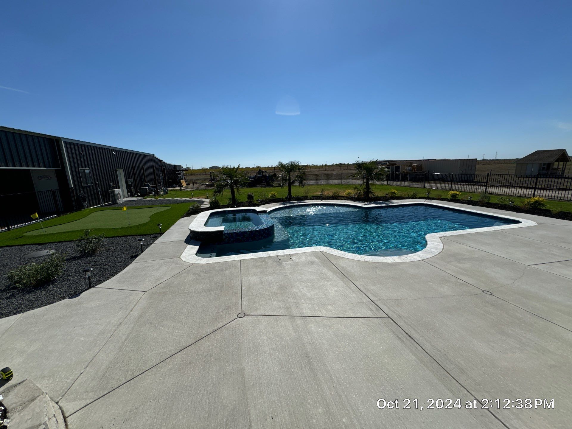 Freeform Pool with Raised Spa by Pinnacle Pools and Spas - DFW