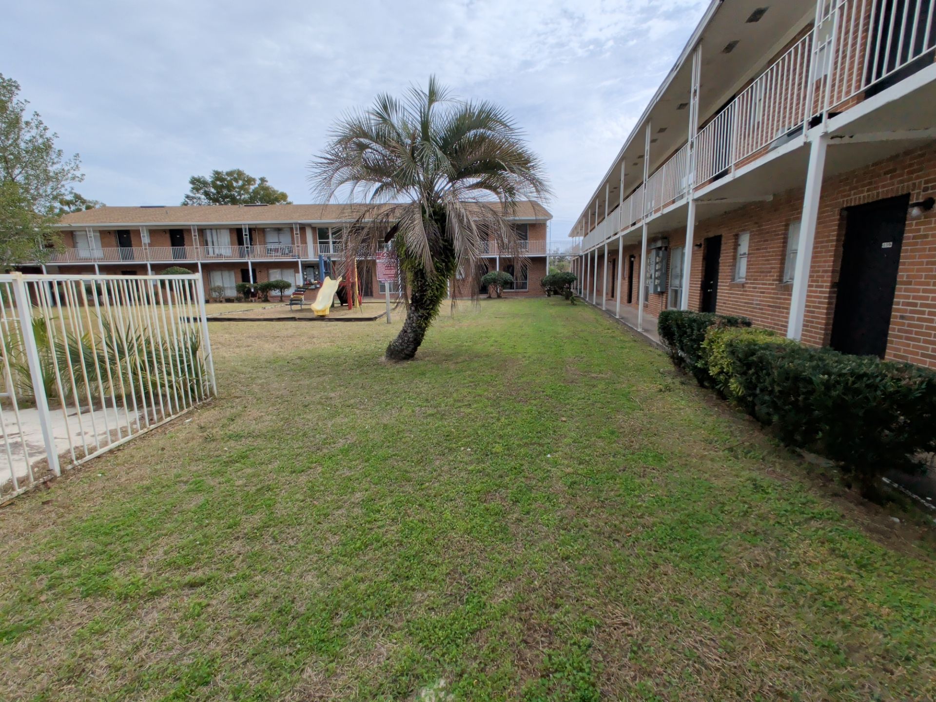 Apartment Landscape Cleanup & Ongoing Grounds Maintenance — Cimarron Apartments (Arlington) by Harmoni Home Services