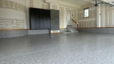 Megan J. added cabinets and slotwall to her garage. Plus a New Floor