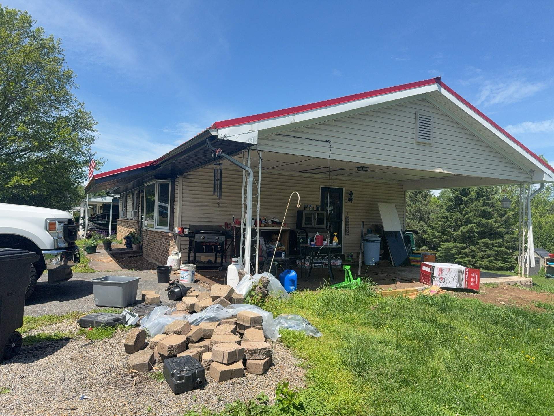 Red ABM Panel Metal Roofing Installation on Elizabethville Ranch Home by Esh Builders