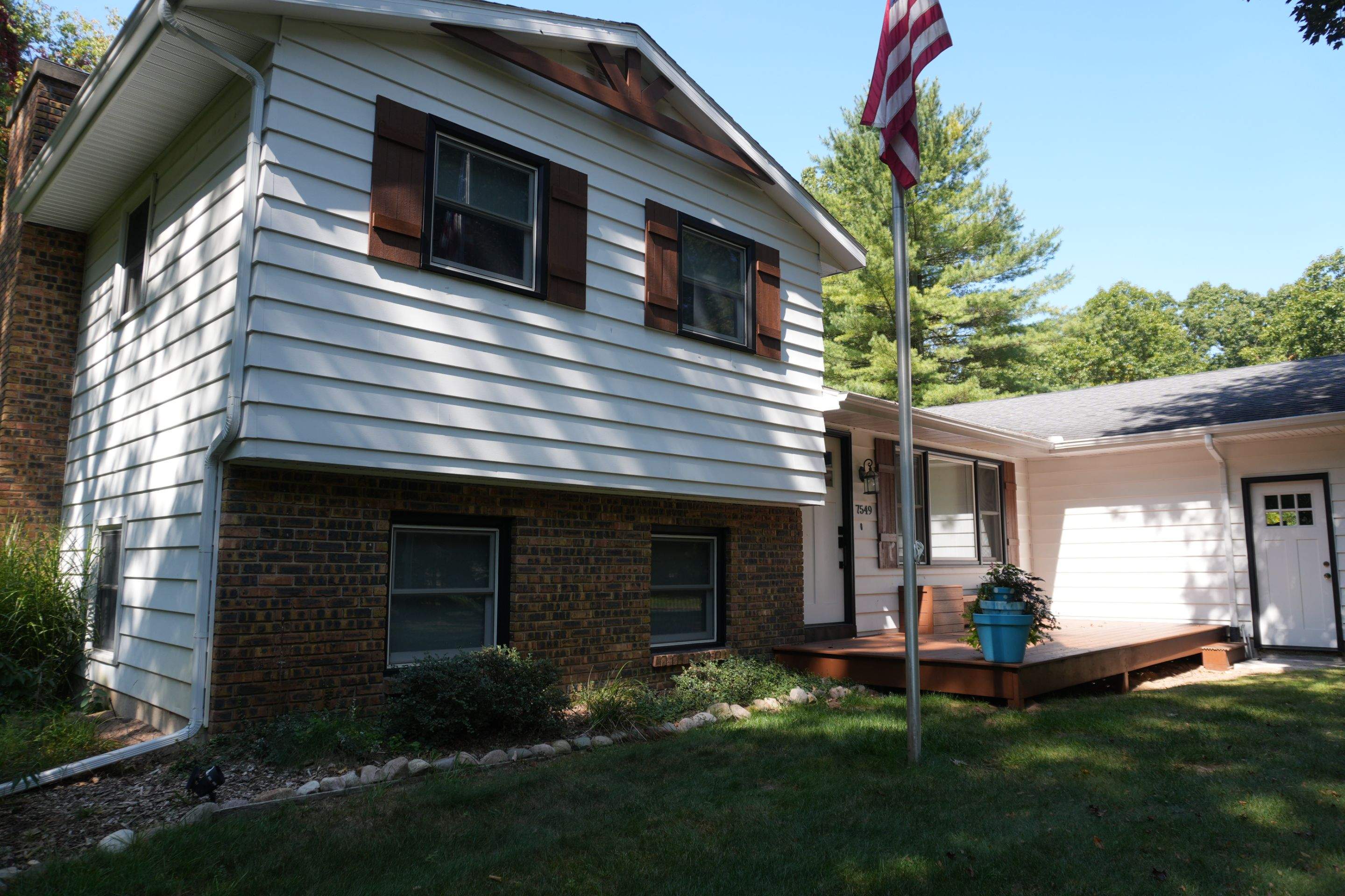 Exterior Remodel & Custom Deck by Cutting Edge Homes