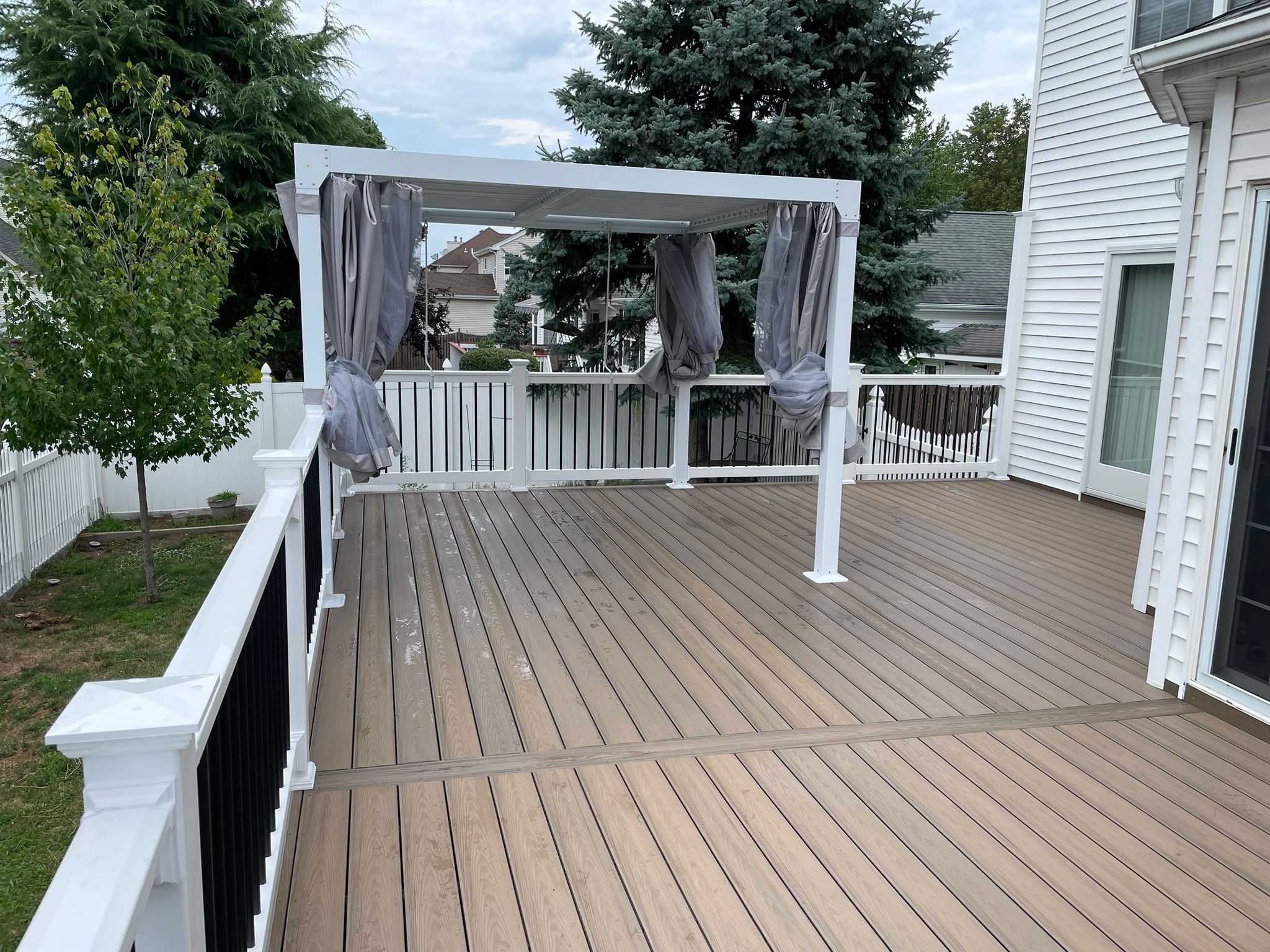 New Deck with Pergola and Vinyl Lattice by deck guardian