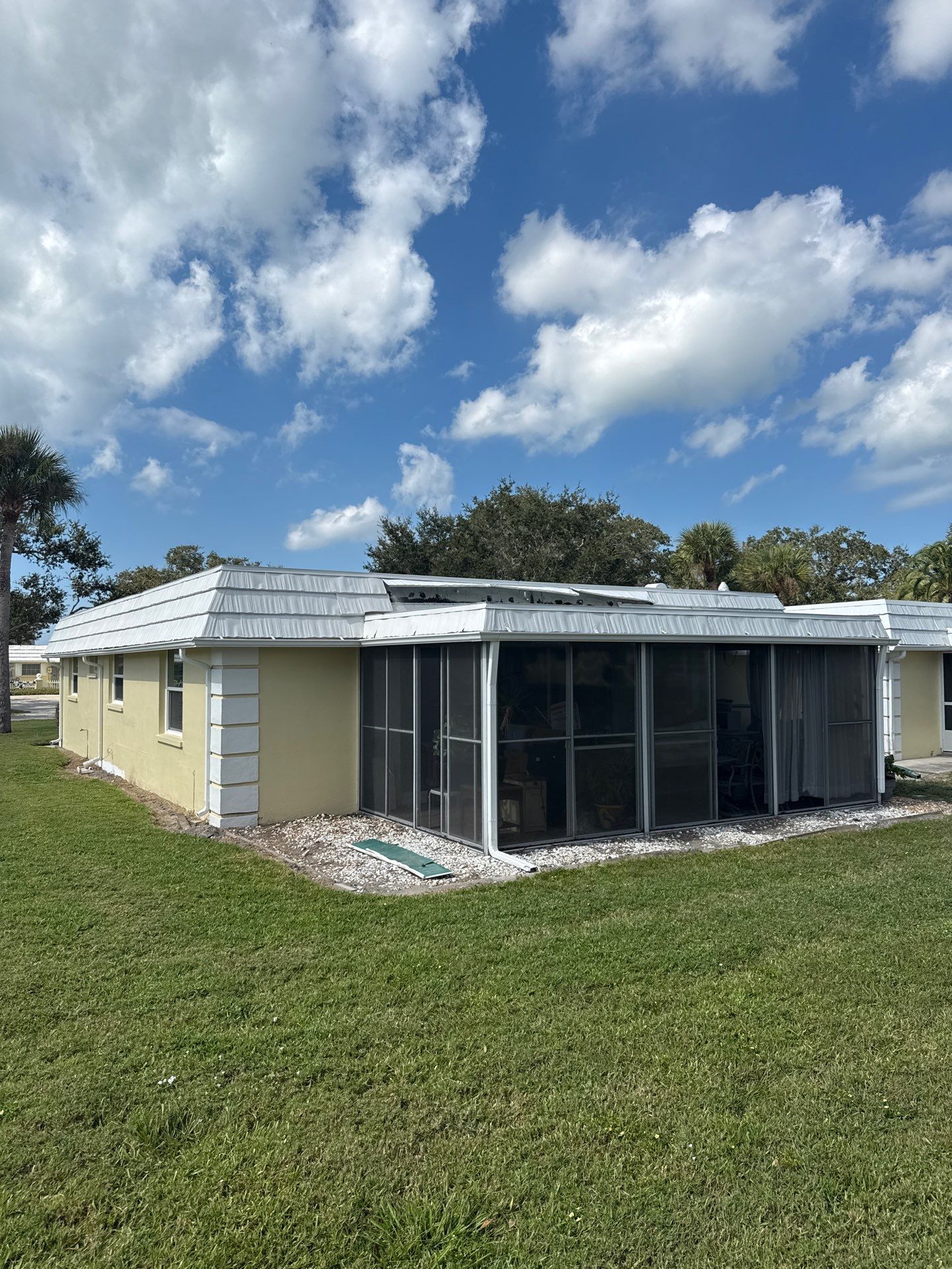 White Gutters and Matching Downspouts in Sarasota FL by Gutter Professors