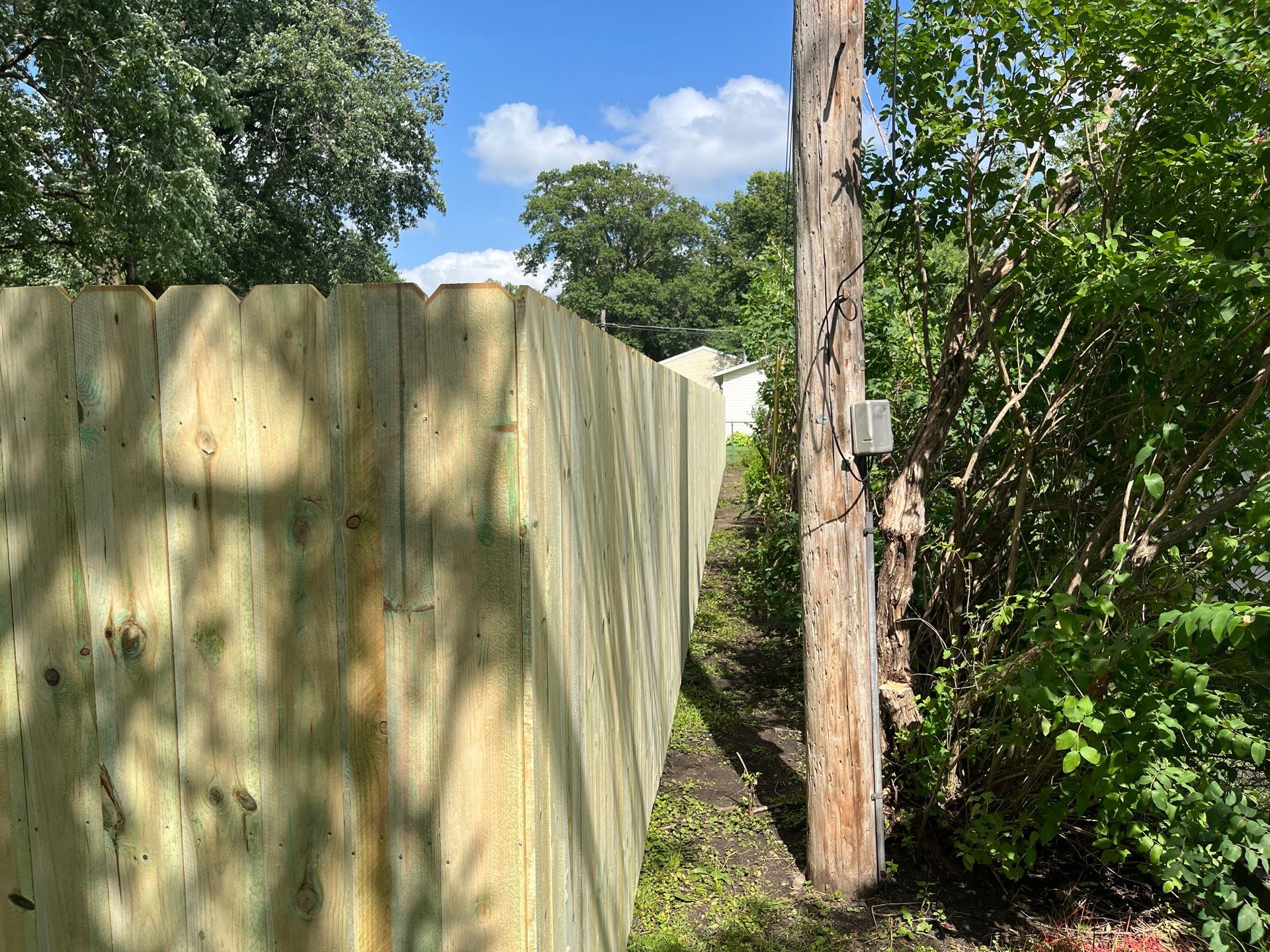 Custom Treated Pine Privacy Fence and Chain Link Installation in Cedar Falls by Perfect Picket Fence and Stain