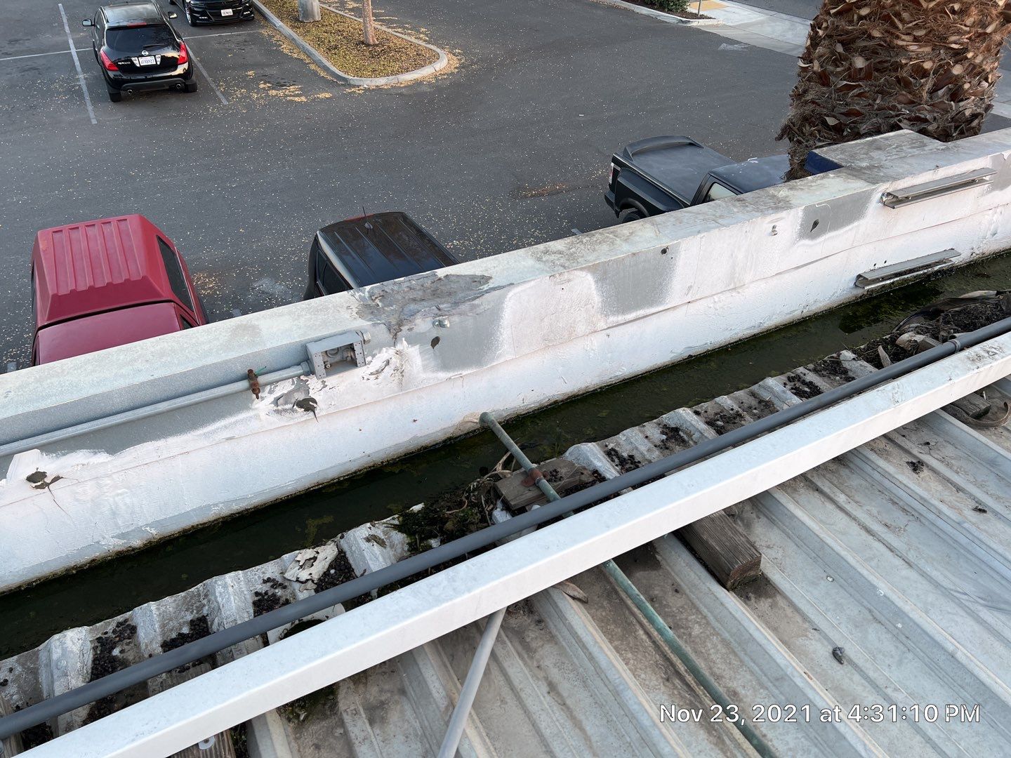 Metal roof restoration on commercial roof using Conklin Benchmark/ PUMA XL acrylic coatings over metal and foam by Straight Edge Roofing Inc
