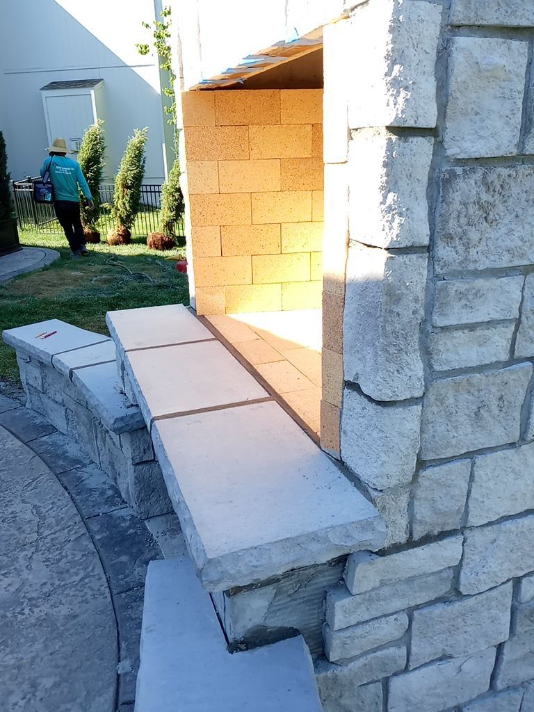 Back Yard Fireplace and Landscape by LAND ESCAPES LLC