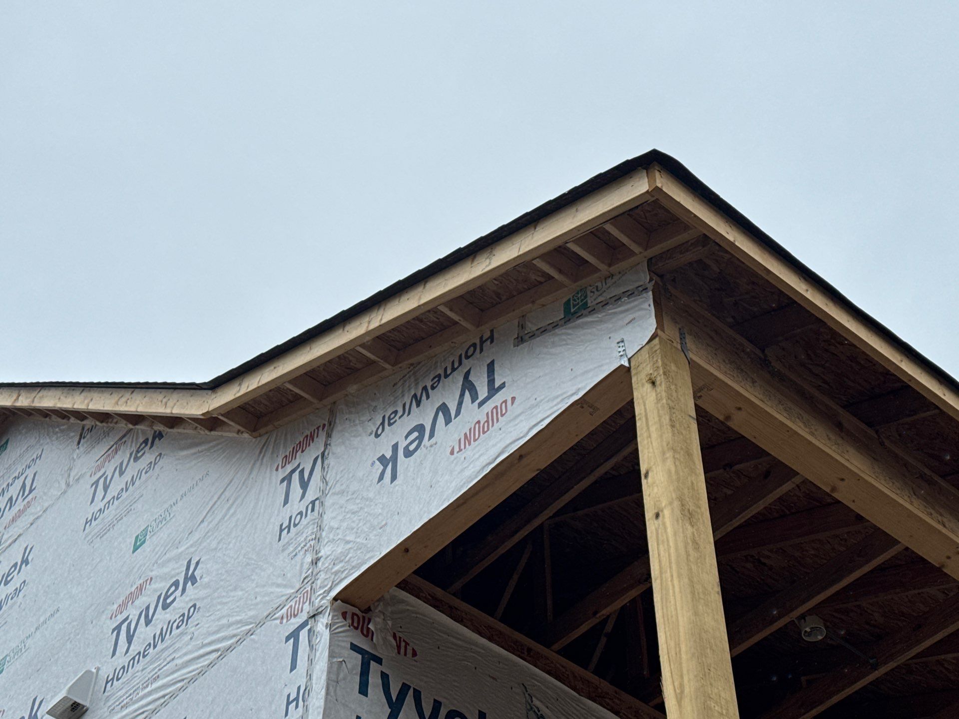 Two-Story Custom Home With Board and Batten Siding by Cade Construction