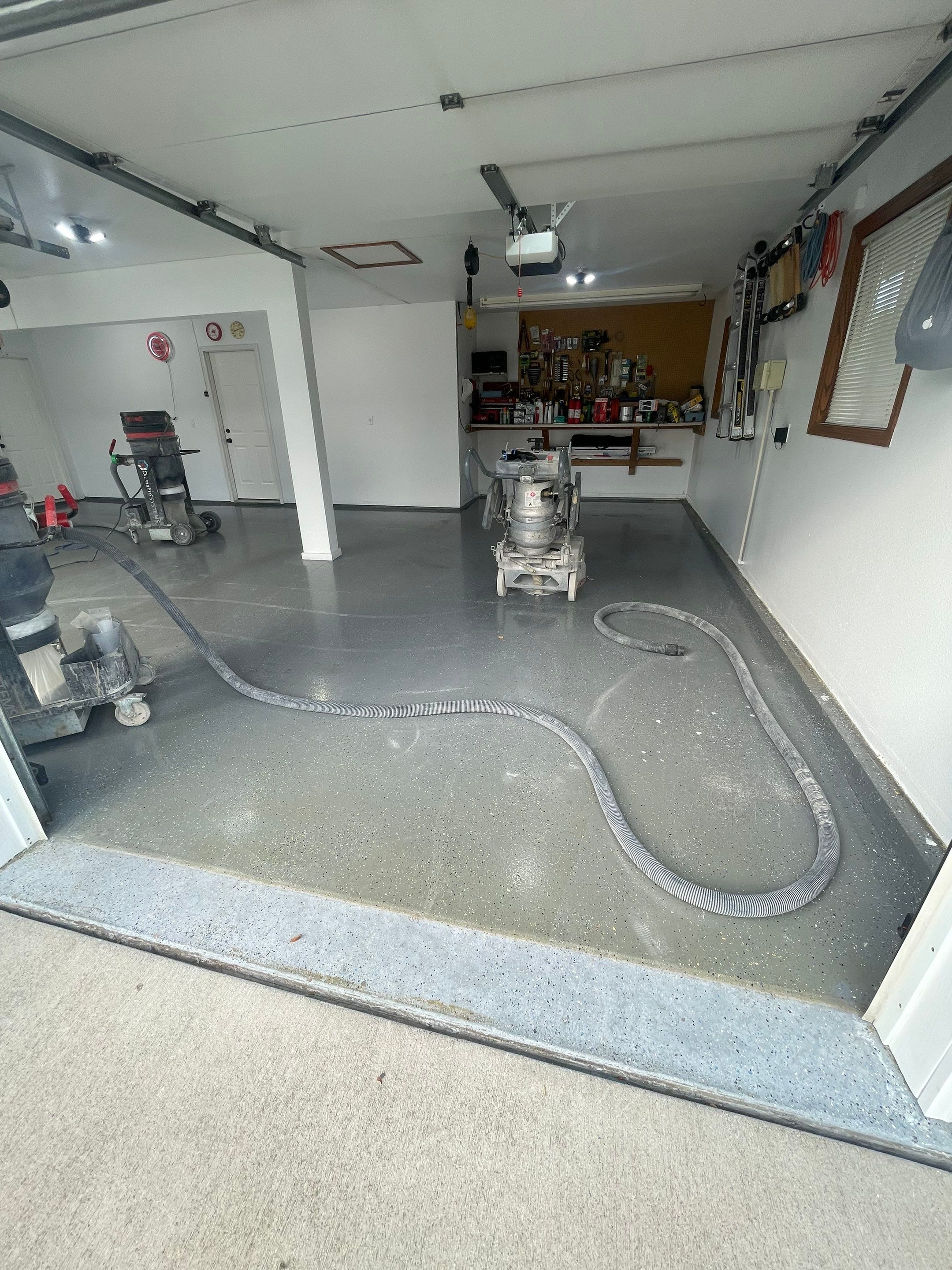Multi-Car Garage Concrete Coating with Coyote Flake Finish in Sioux Falls by Select Painting, Coatings & Garage Cabinets