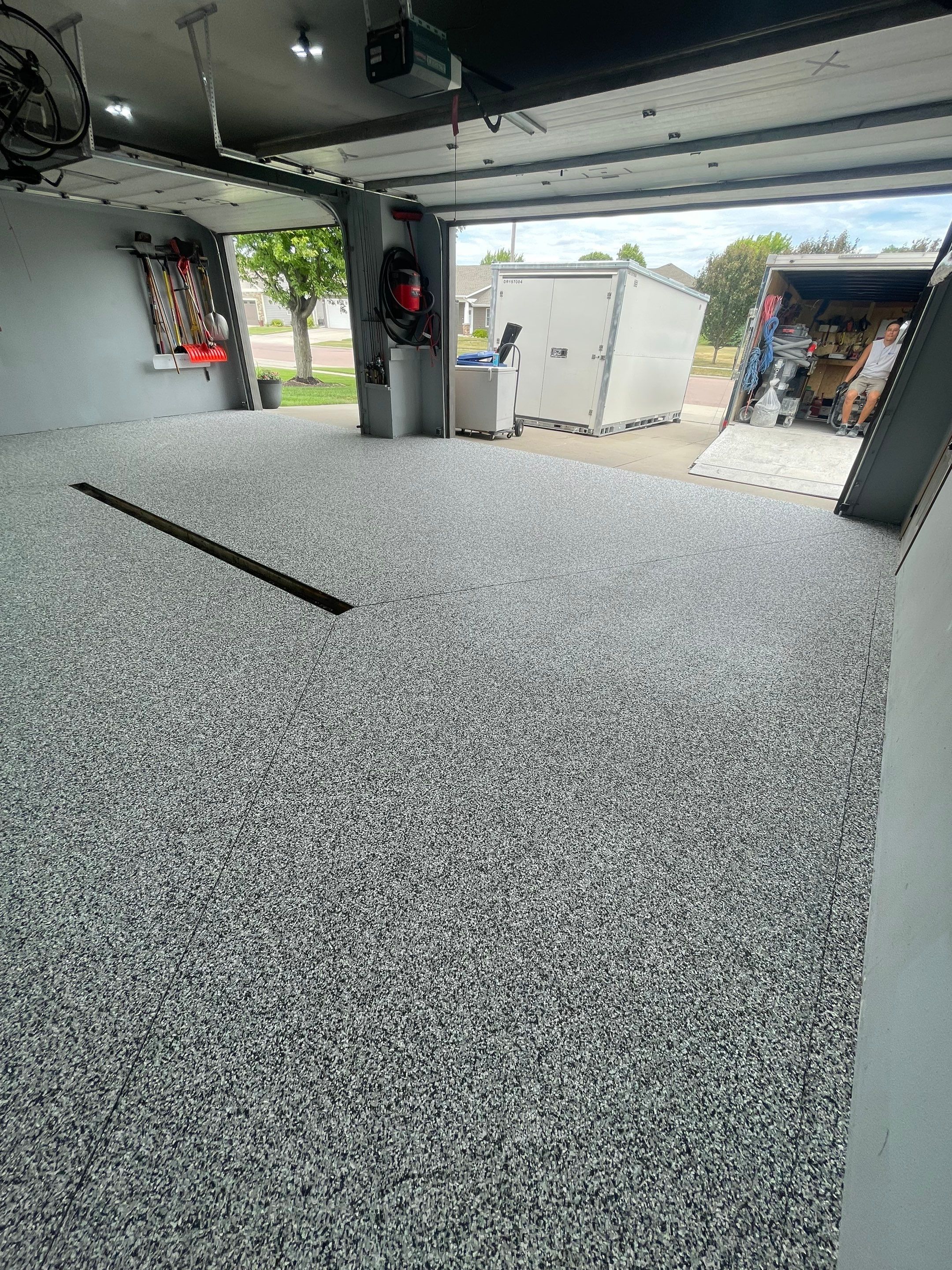 Full Garage Floor Epoxy Coating Installation in Dell Rapids by Select Painting, Coatings & Garage Cabinets