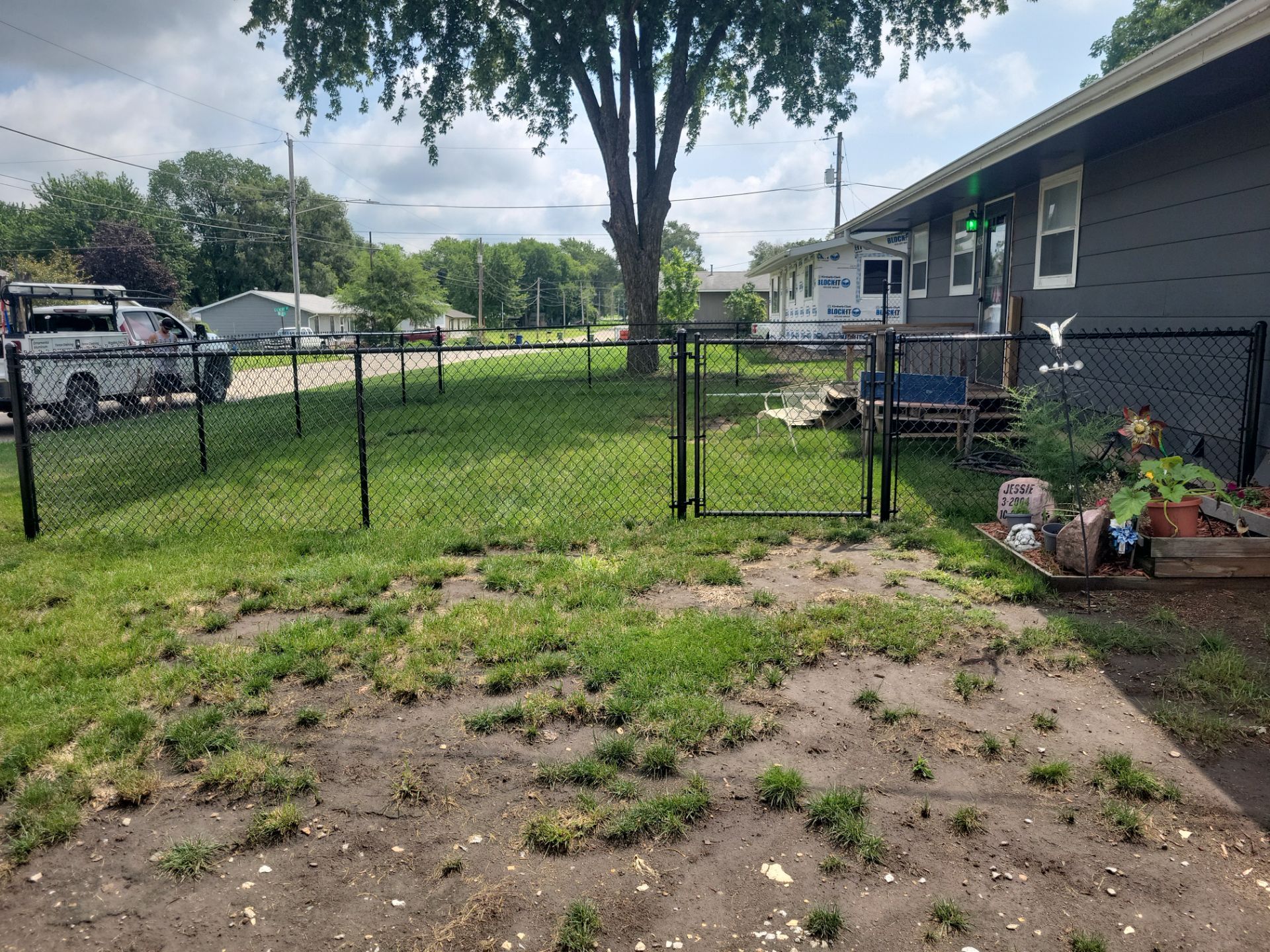 Black Chain Link Perimeter Fence Installation in Waterloo by Perfect Picket Fence and Stain