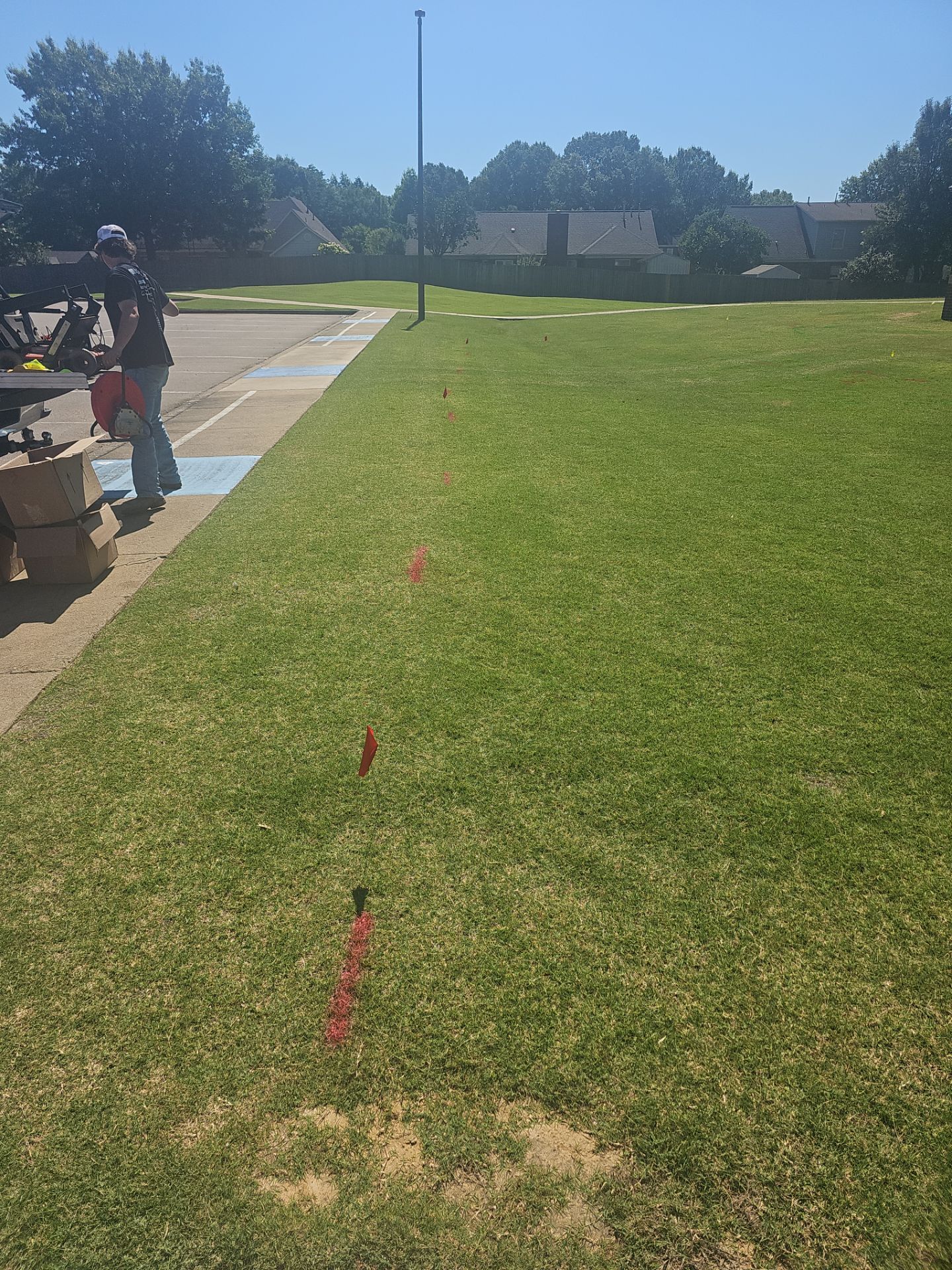 Utility Locating at a school for fence install by Alsip Locating Service, LLC