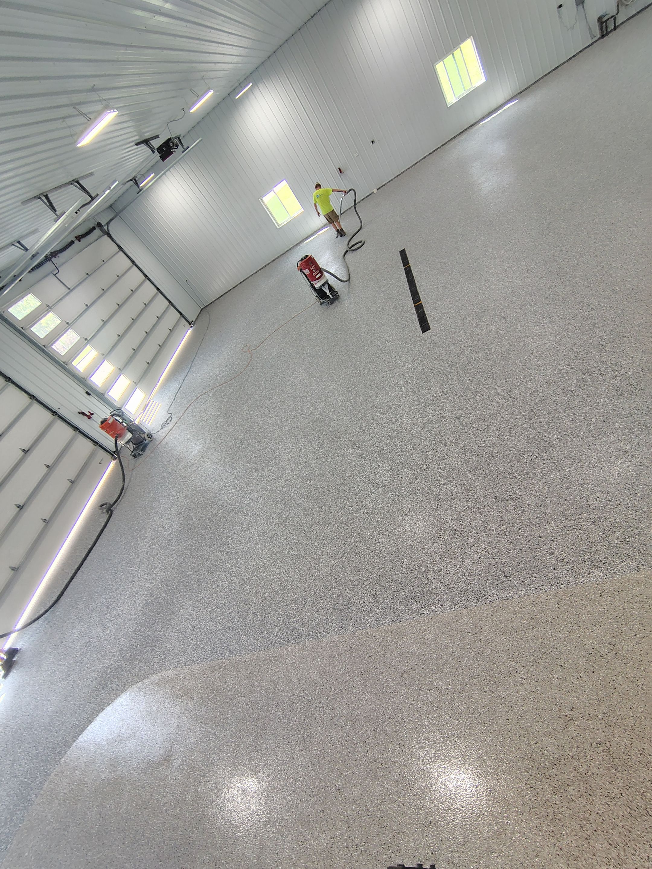 Multi-Stage Concrete Floor Coating for Egan Shop and RV Storage by Select Painting, Coatings & Garage Cabinets