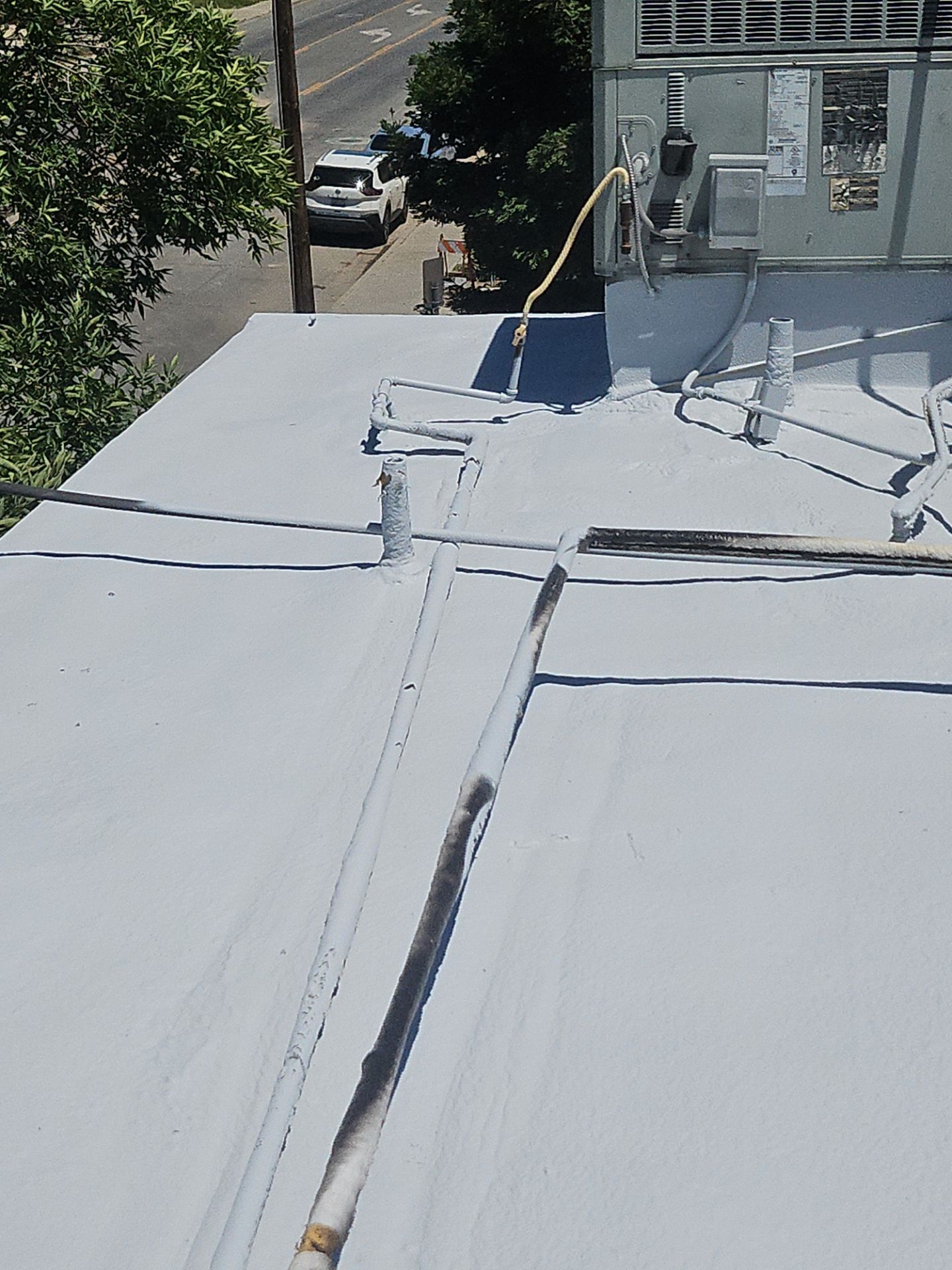 Foam Refurbish using General Coatings acrylic coatings and spray foam by Straight Edge Roofing Inc