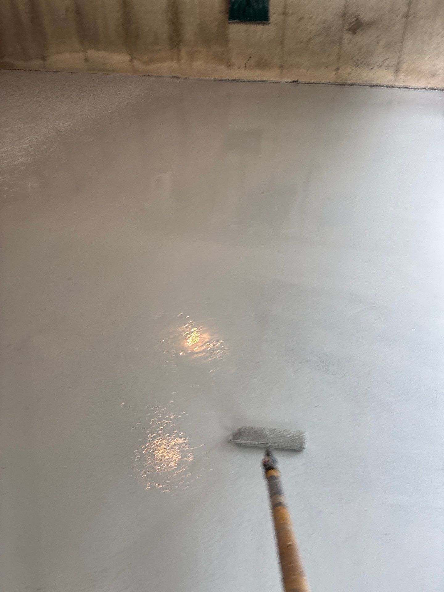 Tidal Wave Concrete Floor Coating Transformation by DiGiorgi Roofing and Siding Inc