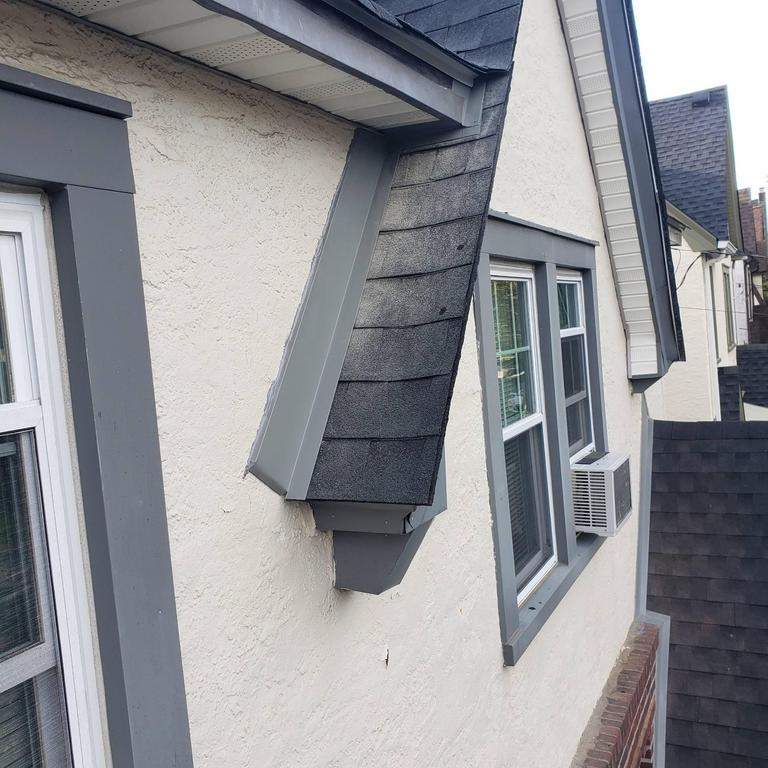 New Roof & Gutters by Island Roofing Inc.