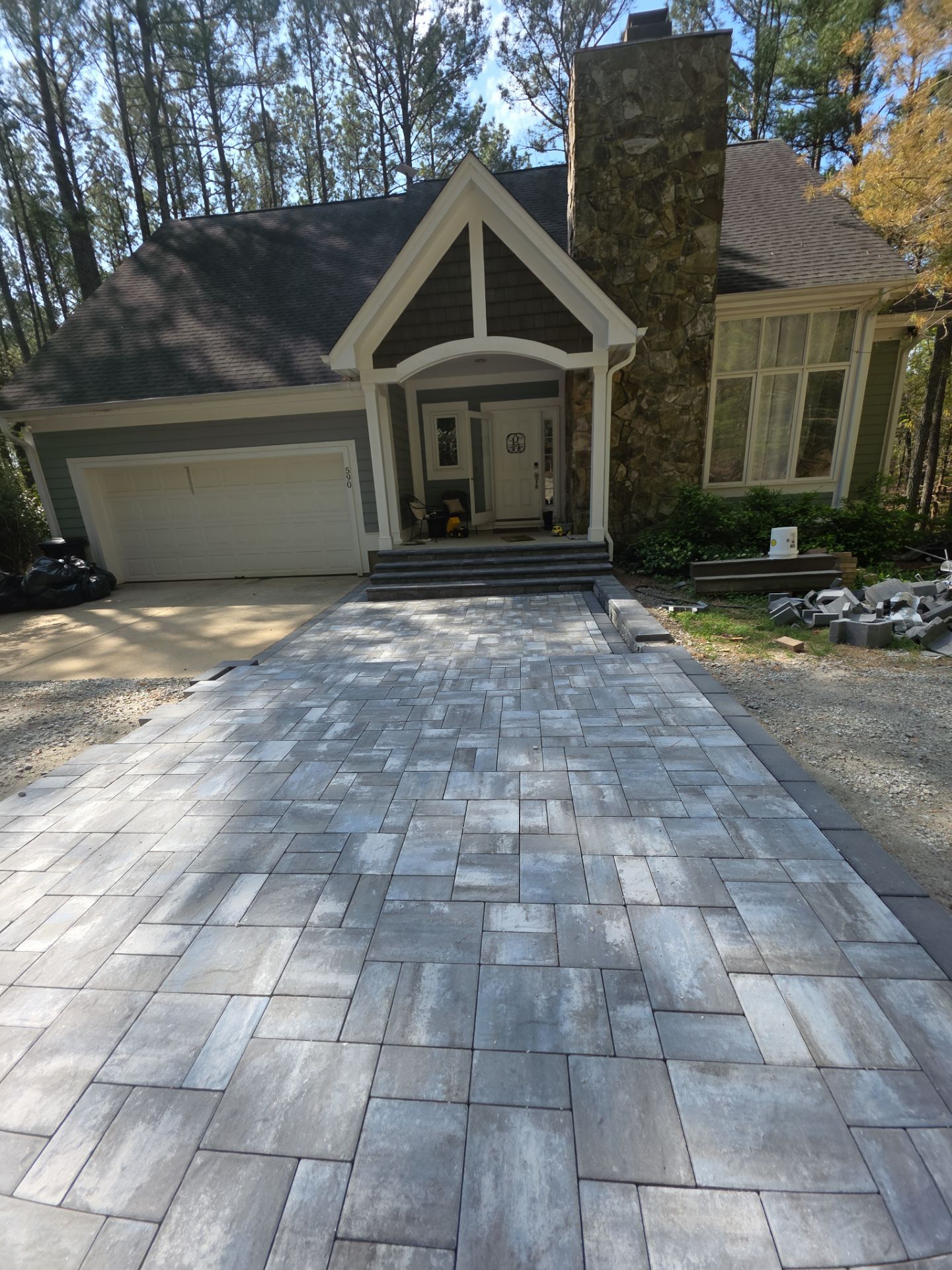 Pittsboro Outdoor Living Transformation – Retaining Wall, Paver Patio & Elevated Deck by Elite Remodeling and Design LLC