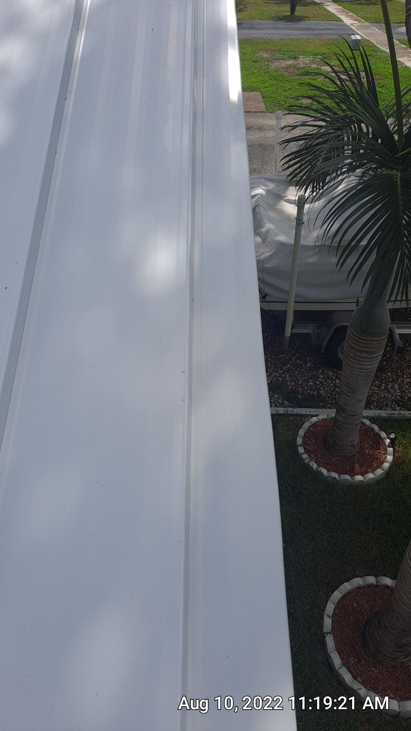 Residential Roofing Installation using 1.5" Nail Strip 24ga Solar White Kynar Coated Standing Seam Metal Panels by Morton Roofing, Inc.