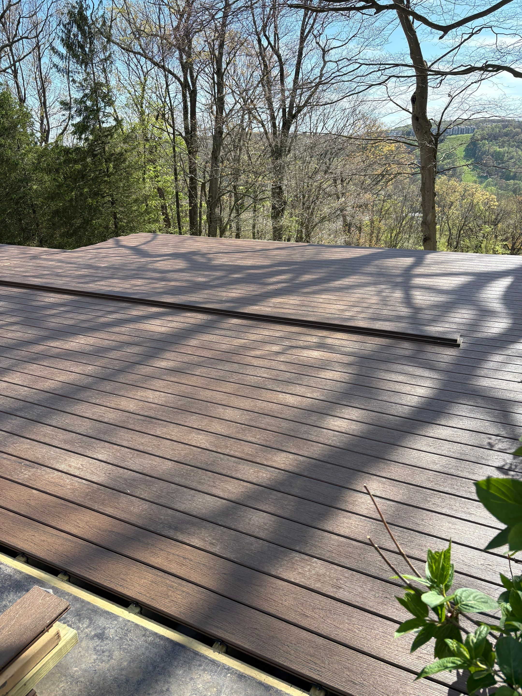 1500 sq/ft Composite Deck Build with Outdoor Kitchen in Champion by Cousins Roofing Siding & Decks