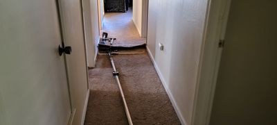 Fixing Carpet Wrinkles in a Hallway