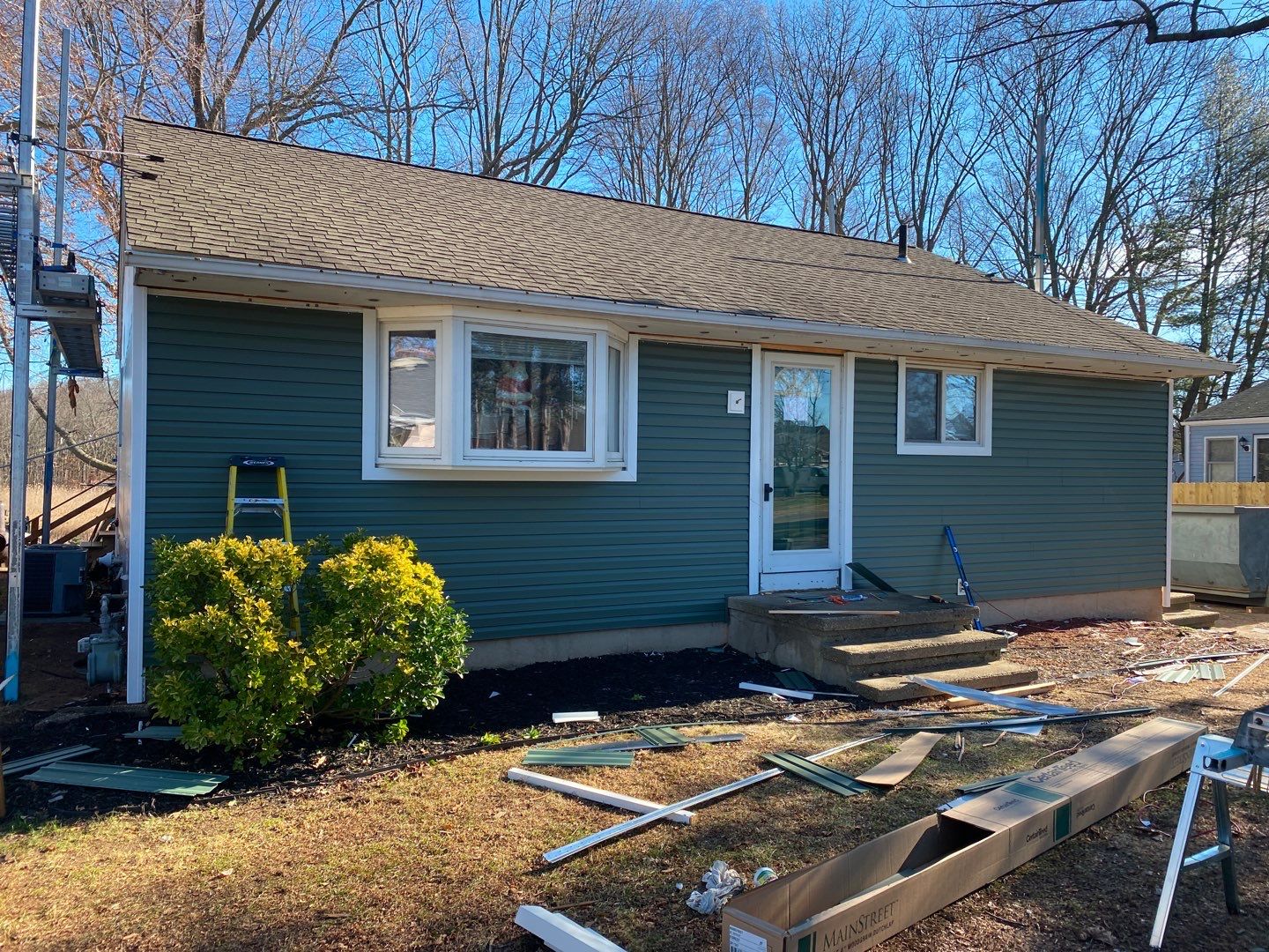 Siding Installation using Certainteed Mainstreet Forest Green by A Plus Exterior