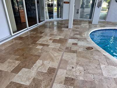 Travertine Sealing and Stripping for a Waterfront Pool Deck in Apollo Beach