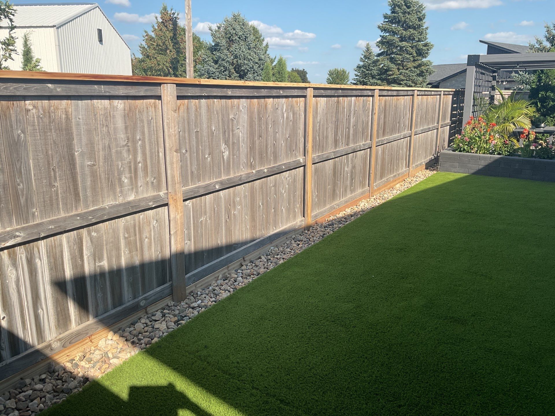 Custom Privacy Fence and Paver Patio Installation in Sioux Falls by Select Painting, Coatings & Garage Cabinets