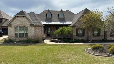 IKO Granite Black-Light Brown with dark brown sections brick house