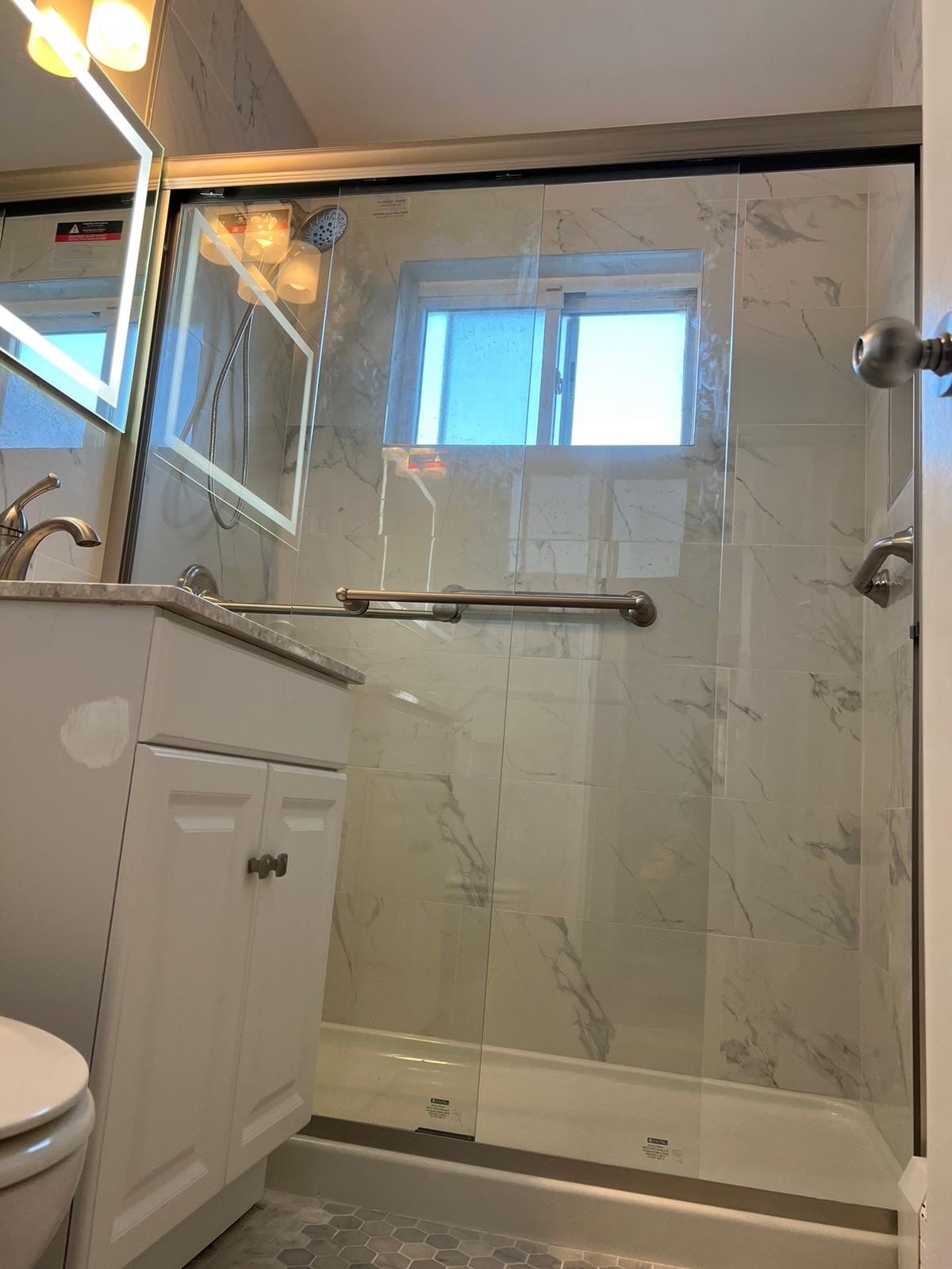 Bathroom Remodel using Tile by Home Concepts Construction