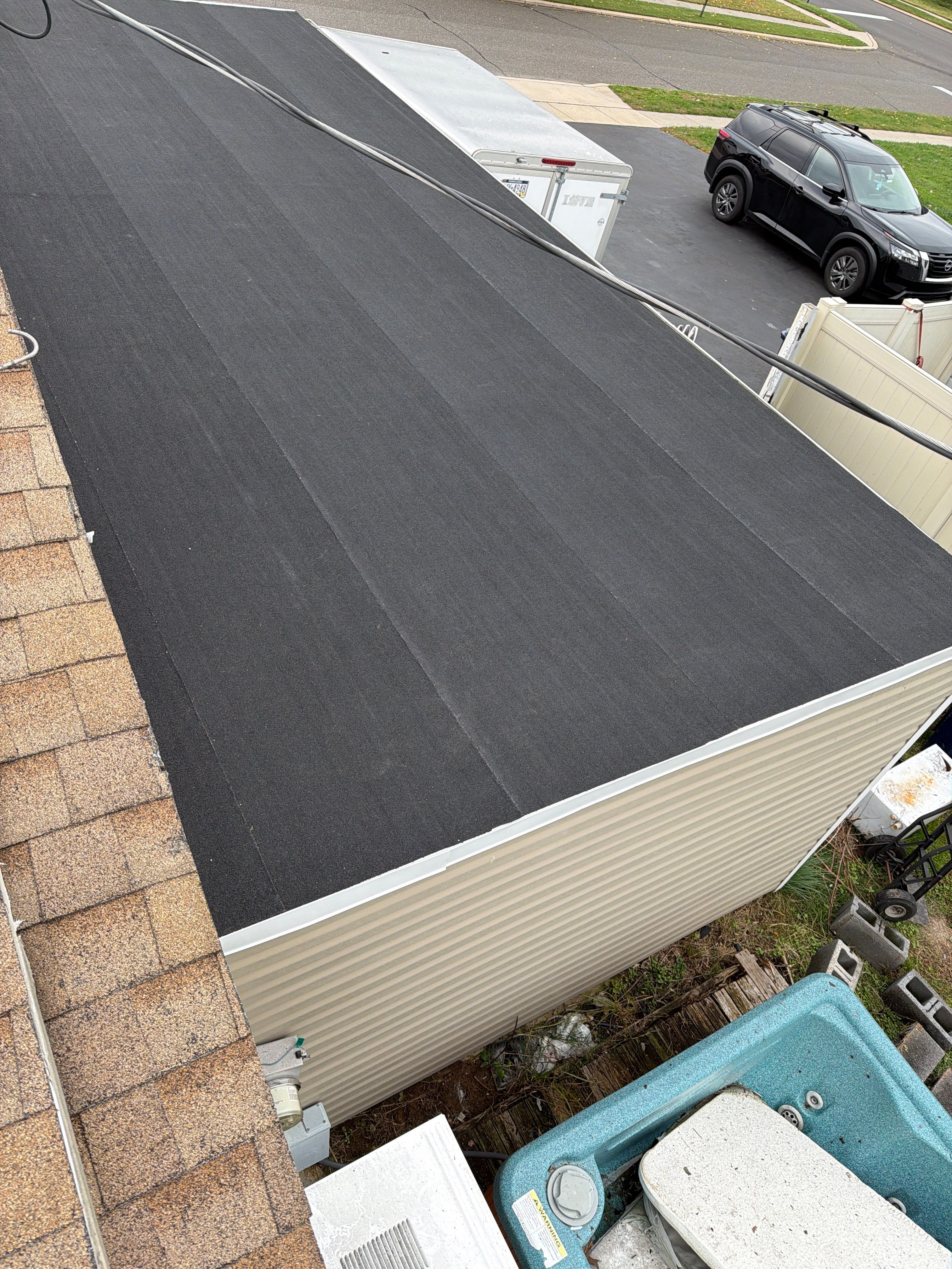Flat Roof Replacement and Shingle Integration in Levittown by Stofan Construction LLC