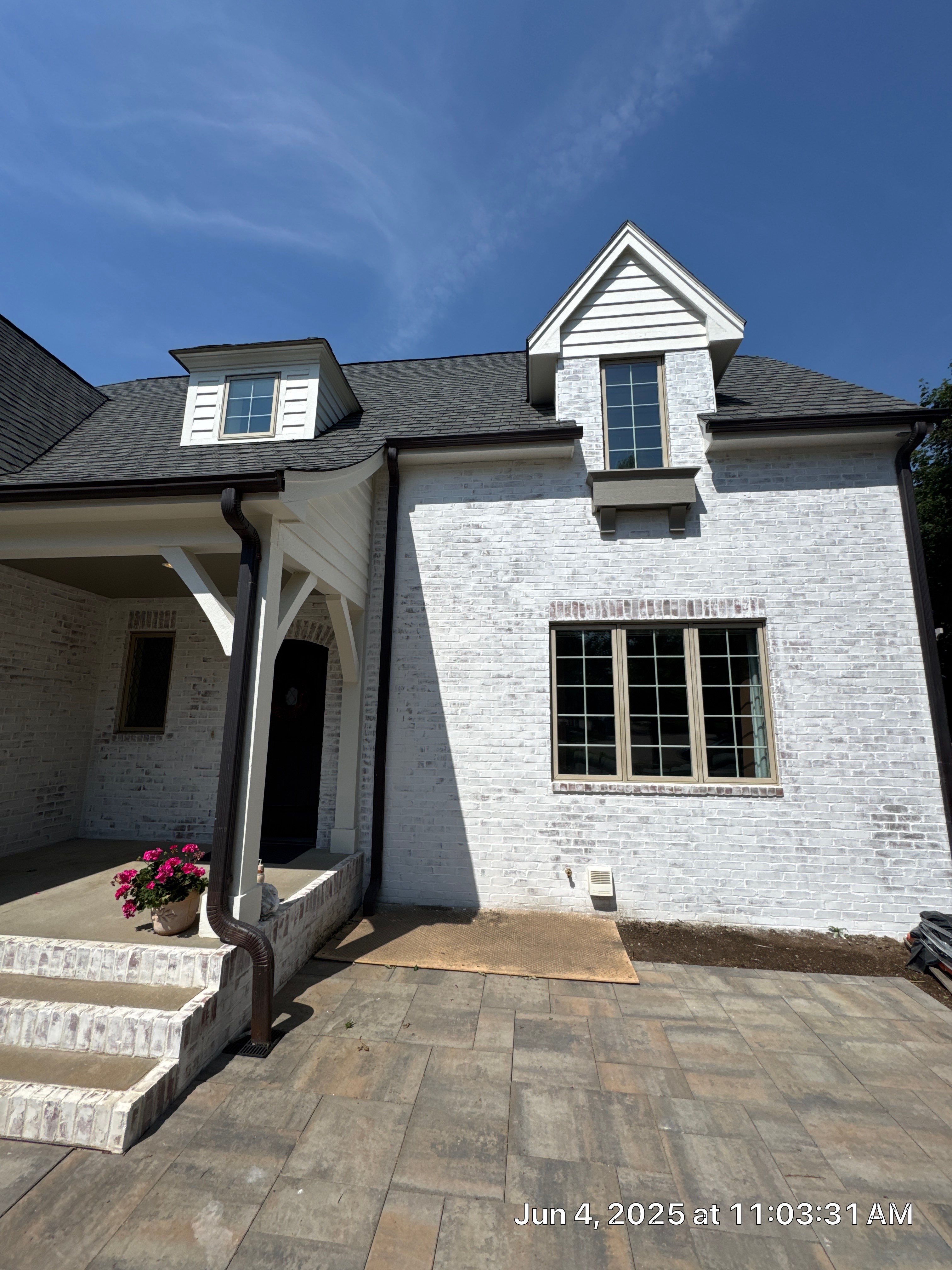 Residential Exterior Brick Painting and Limewash Refresh in Sioux Falls by Select Painting, Coatings & Garage Cabinets