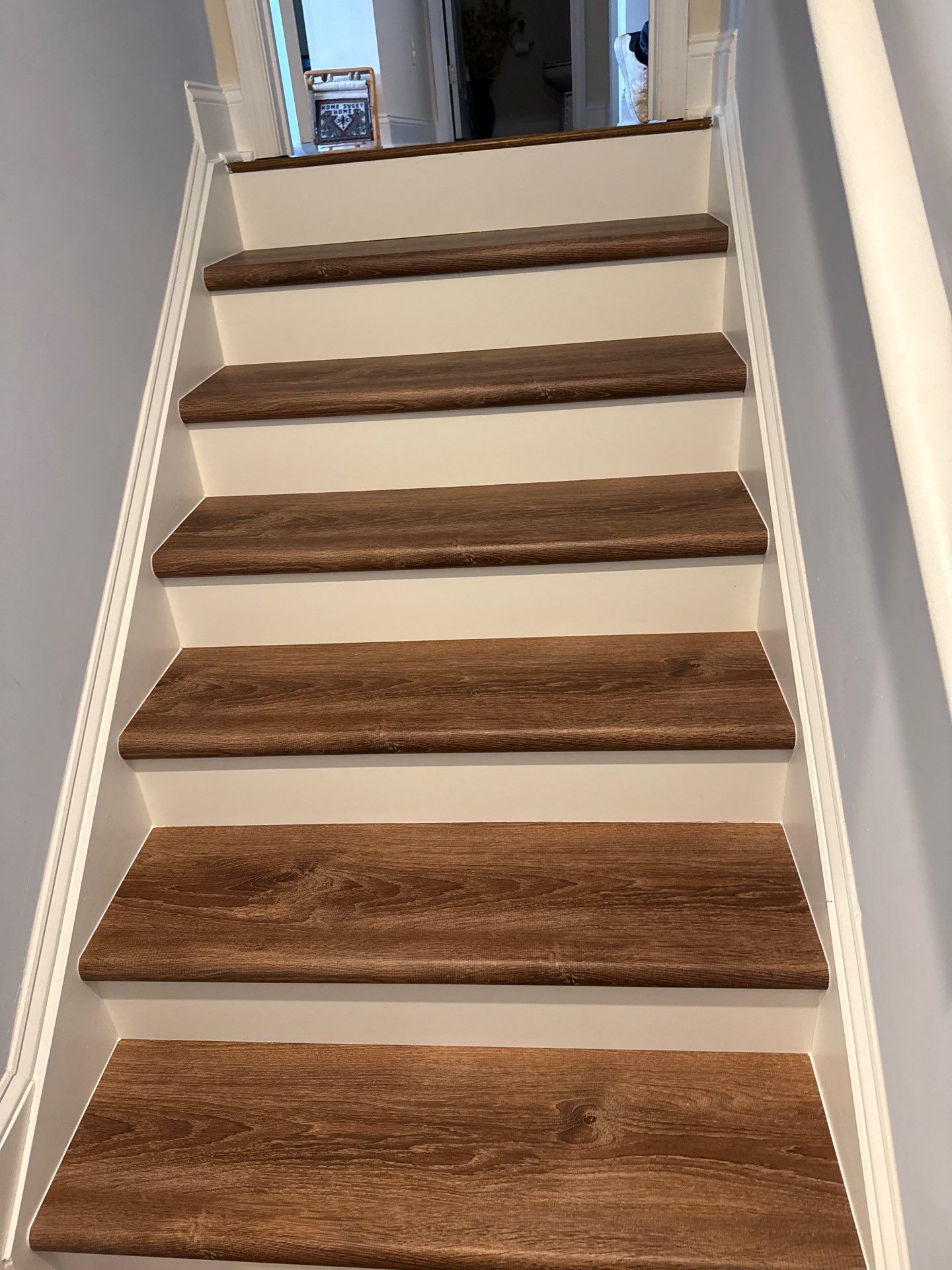 Stairway Installation using t vinyl stair tread and reversibleriser by La Bendicion Contruction Llc