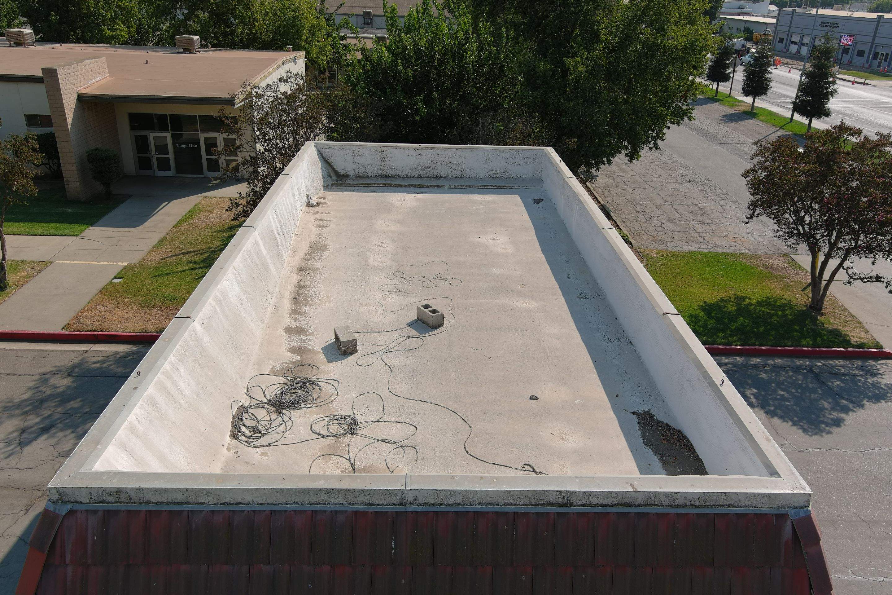 Commercial Roofing Installation using General Coatings acrylic coatings and spray foam by Straight Edge Roofing Inc