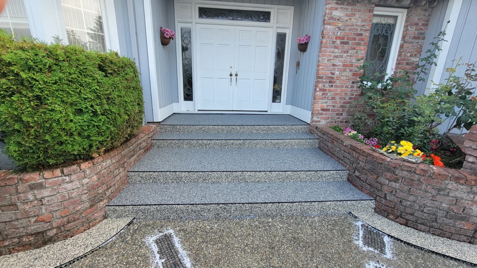 Elegant Driveway and Patio in Palazzo Vuba Stone by Concrete Coating Experts Inc.