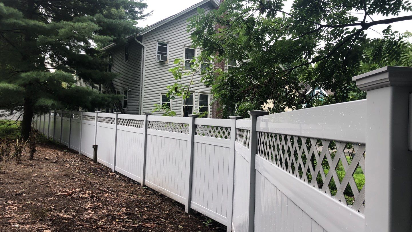Vinyl Privacy Fence with Lattice top, matching gate in White by DiGiorgi Roofing and Siding Inc