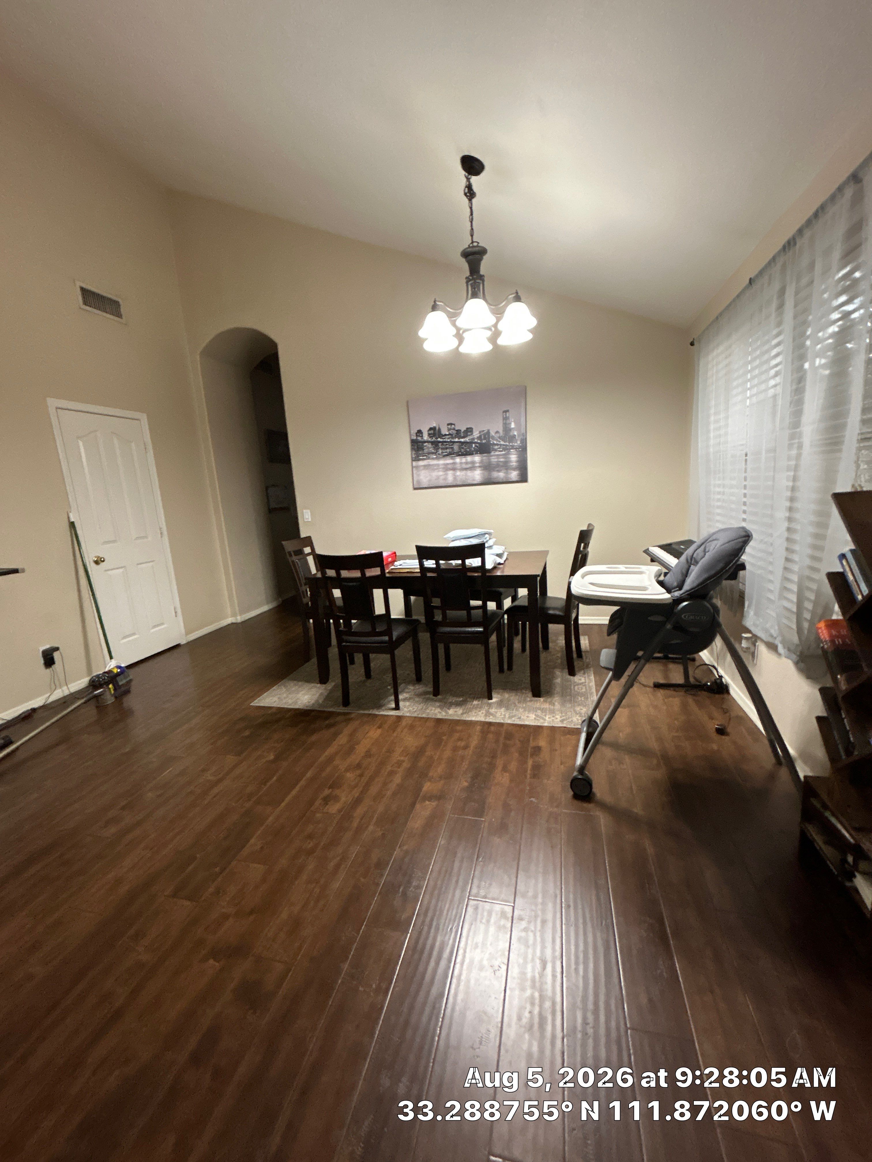 Modern Dining Room Renovation With Dark Wood Flooring in Chandler by CompanyCam Sales Demo