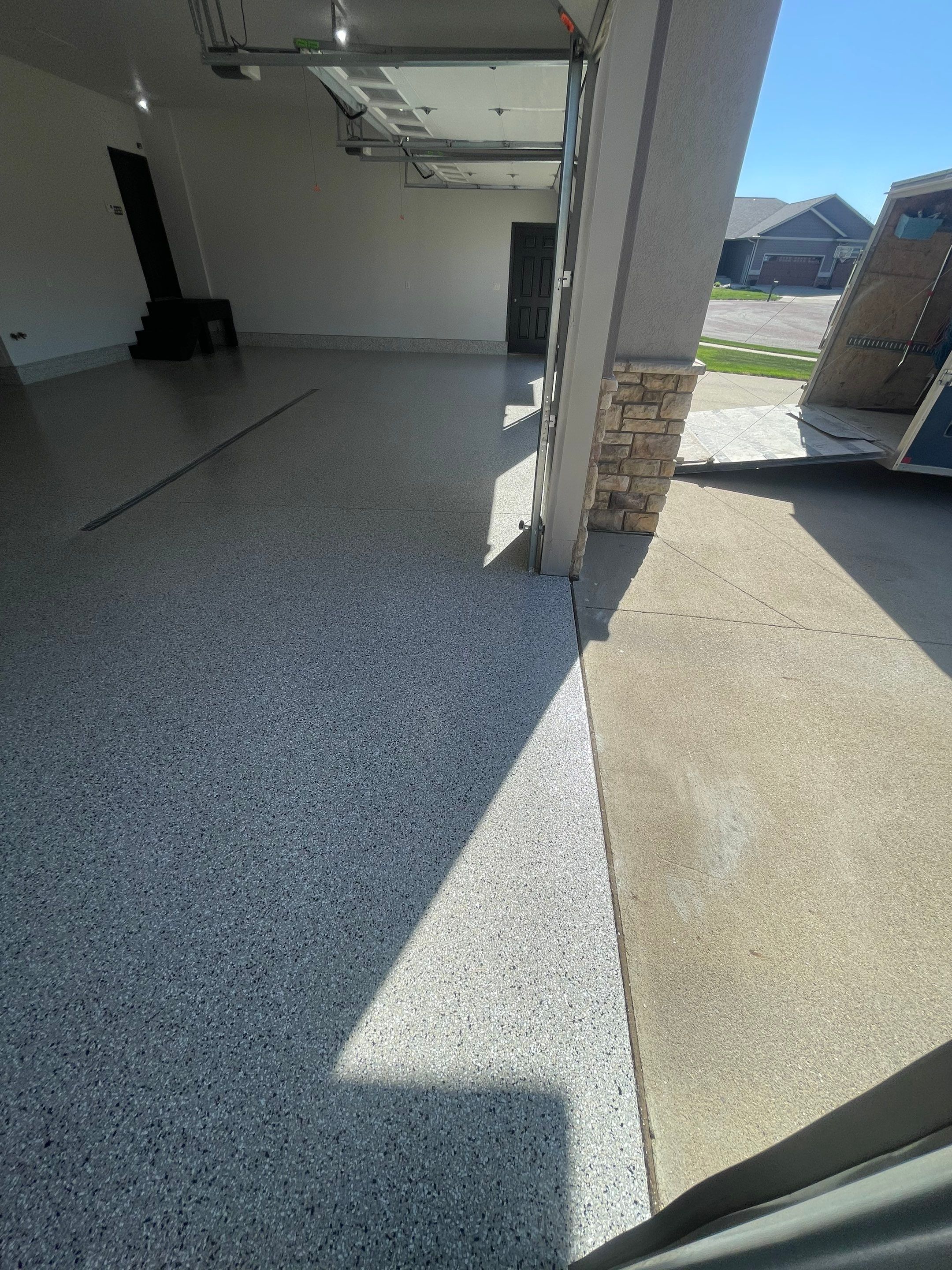 Multi-Car Garage Epoxy Floor Coating in Beresford by Select Painting, Coatings & Garage Cabinets