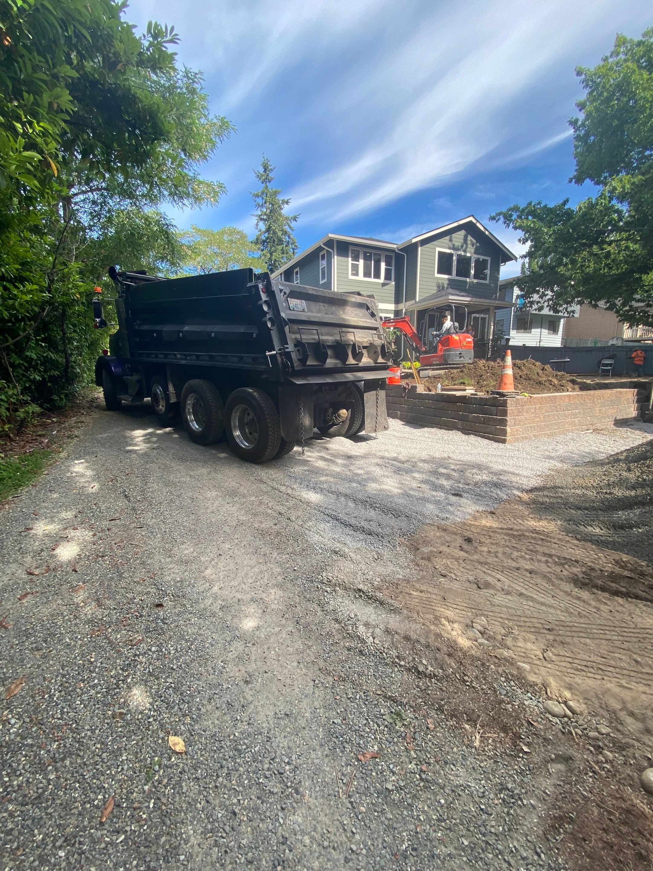 Patio Installation using Concrete, Retaining walls, and Turf install by Jireh Asphalt & Concrete Inc 