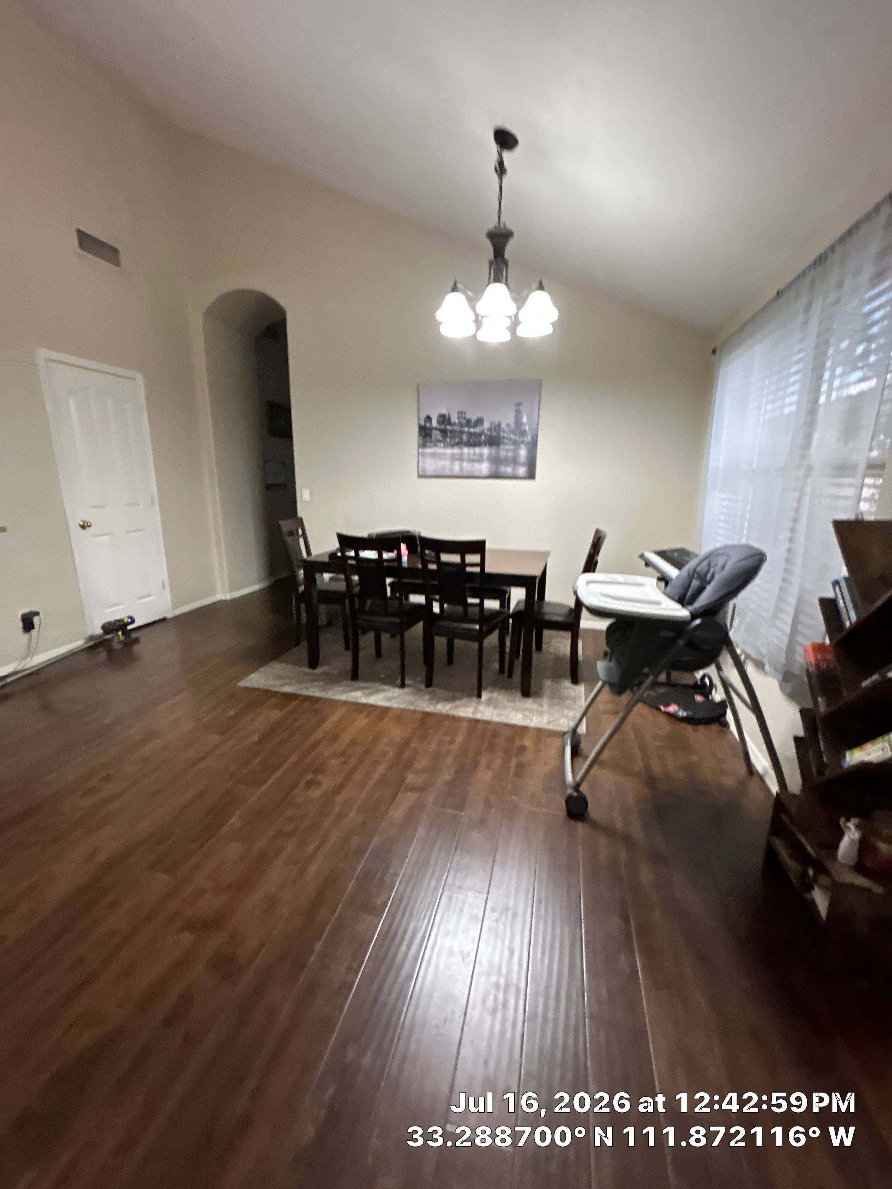 Dark Wood Laminate Flooring Installation for Chandler Dining Room by CompanyCam Sales Demo