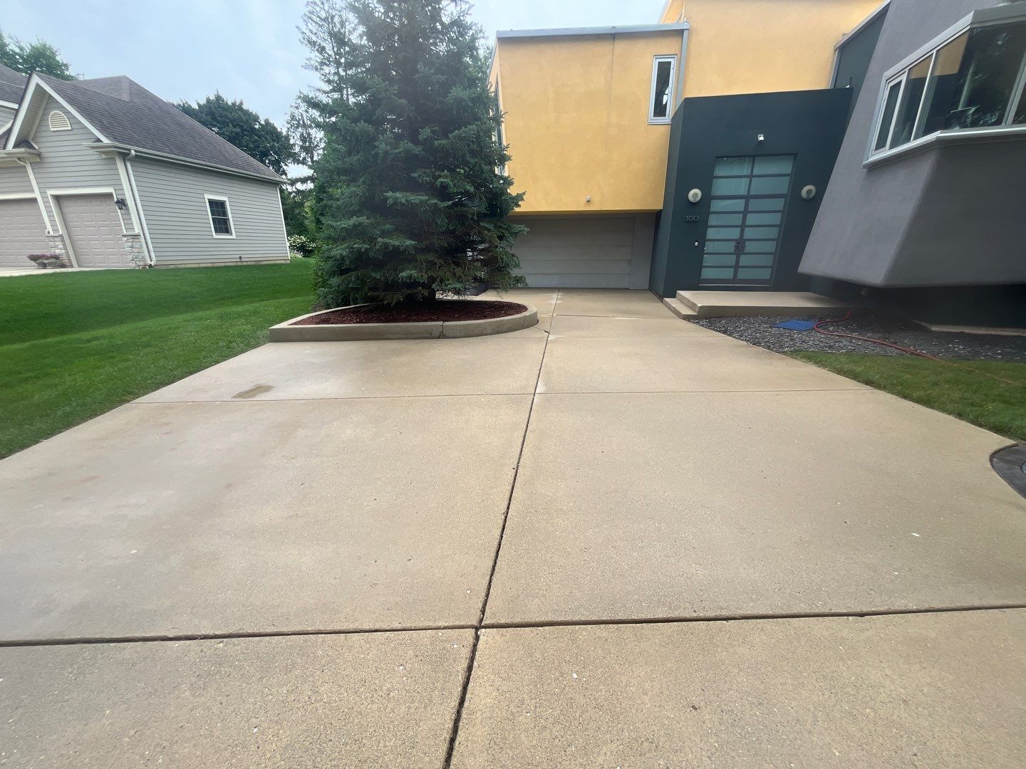roof washing using Algaecide, soft wash soap by Northern Power Washing LLC.