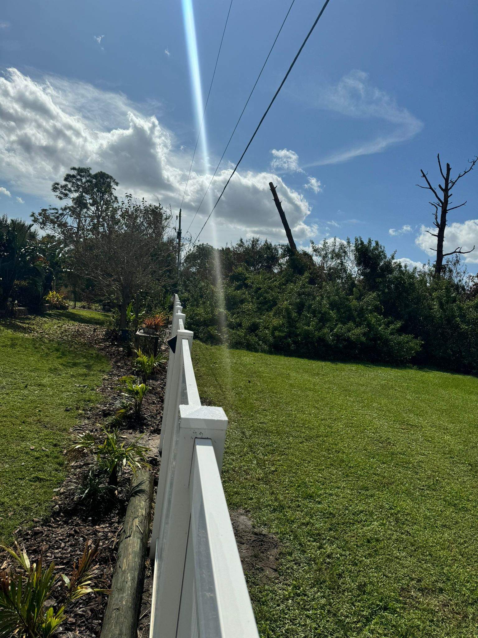 White Vinyl Privacy Fence Installation in Port Charlotte by True Fence LLC