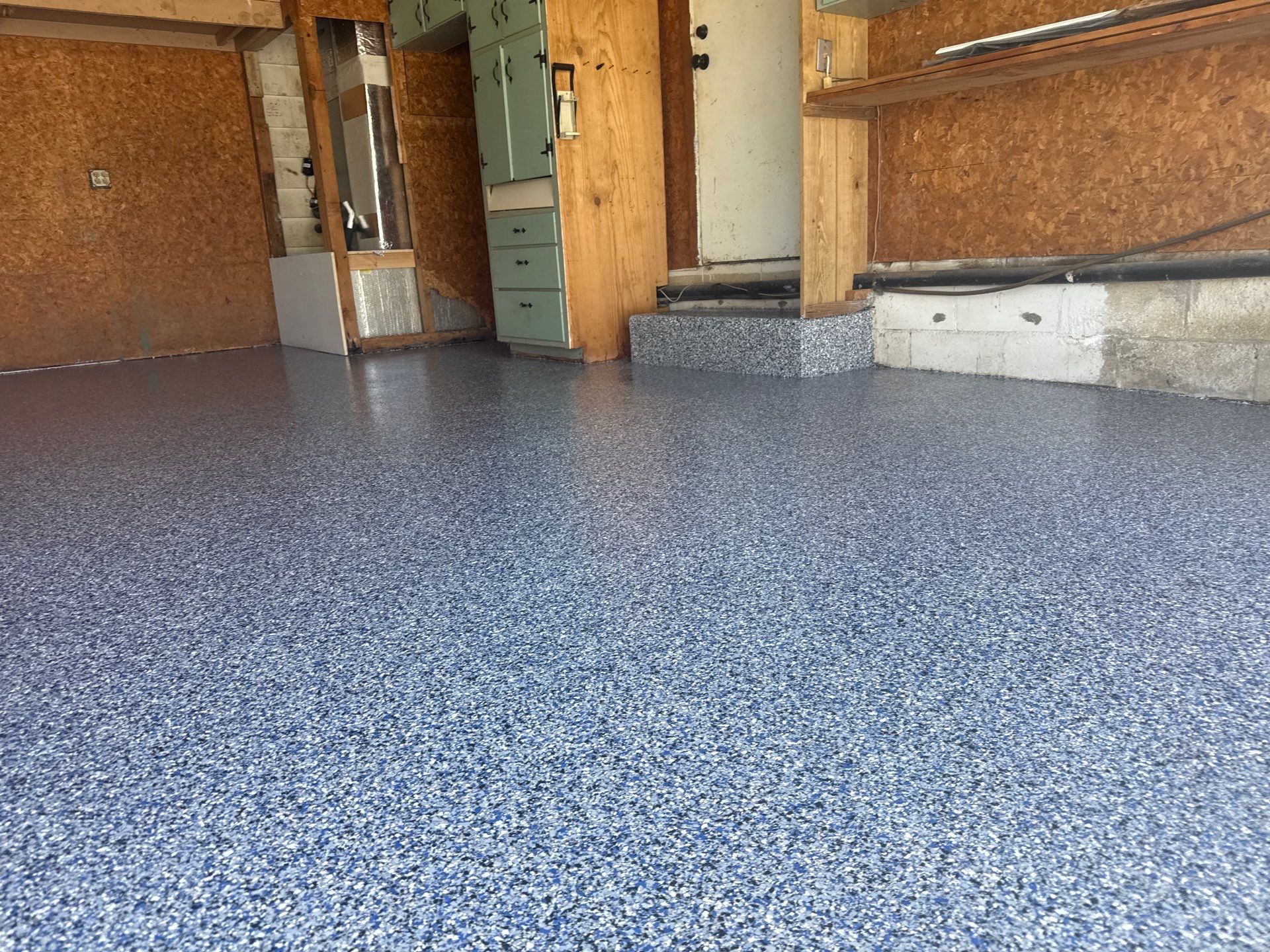 Garage in Midnight by Innovative Concrete Coatings 
