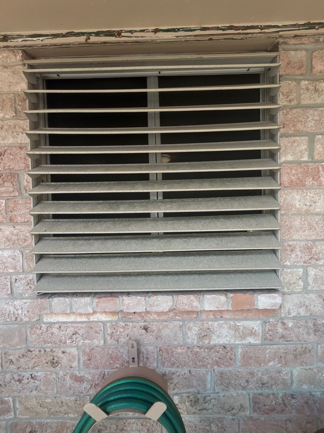 Colored Vinyl Windows to blend into brick by Bayfront Roofing and Construction