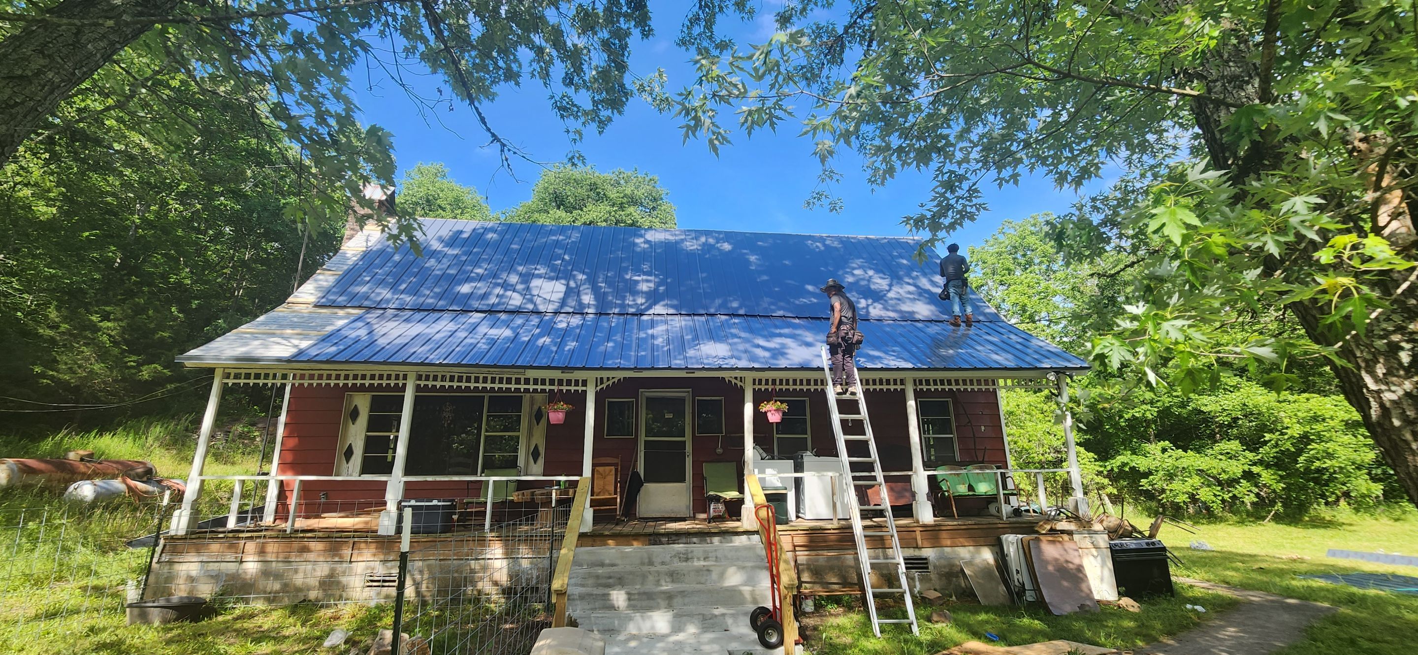 Residential Roofing Installation using 26 Gauge Colored Panels by Hostetler Roofing