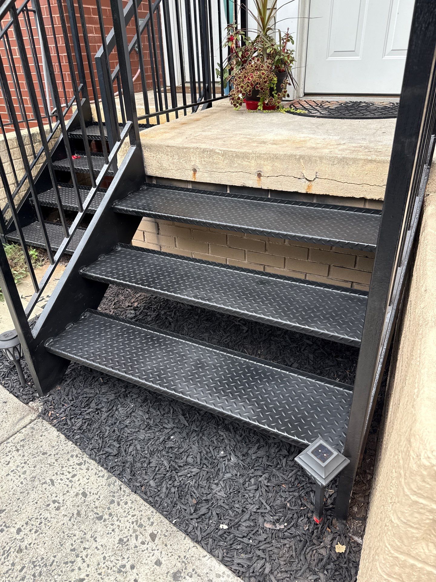 Black Metal Diamond Plate Staircase Restoration in Washington, DC by Capitol Iron Works