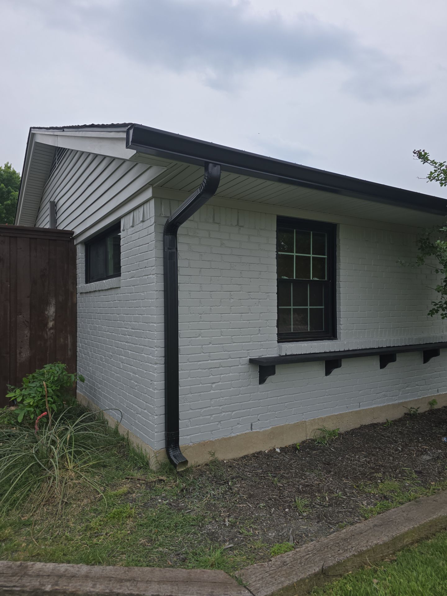 Exterior Home Paint Project with Different Surfaces by SLM General Contractors & Roofing